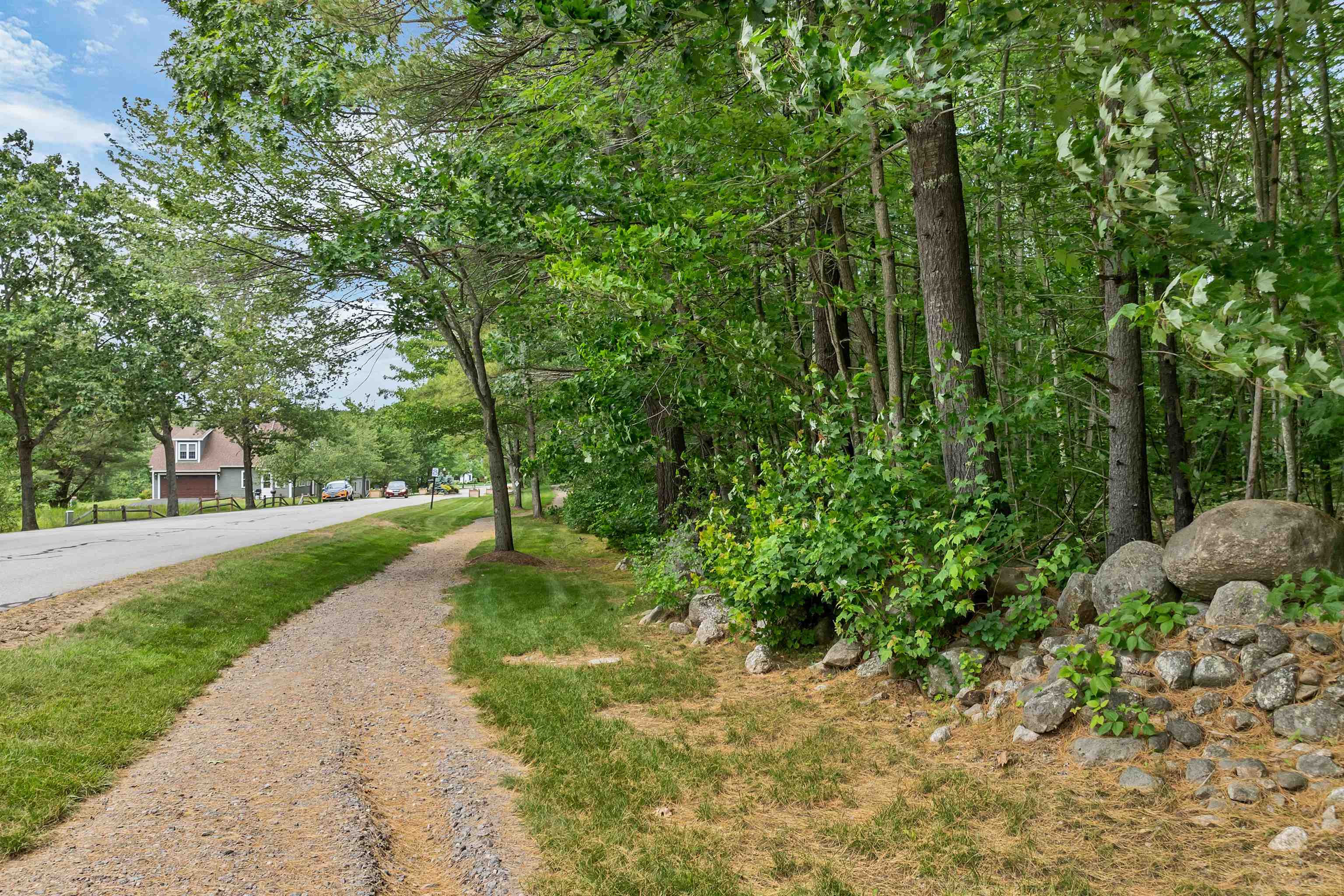 Property on the right of stone wall