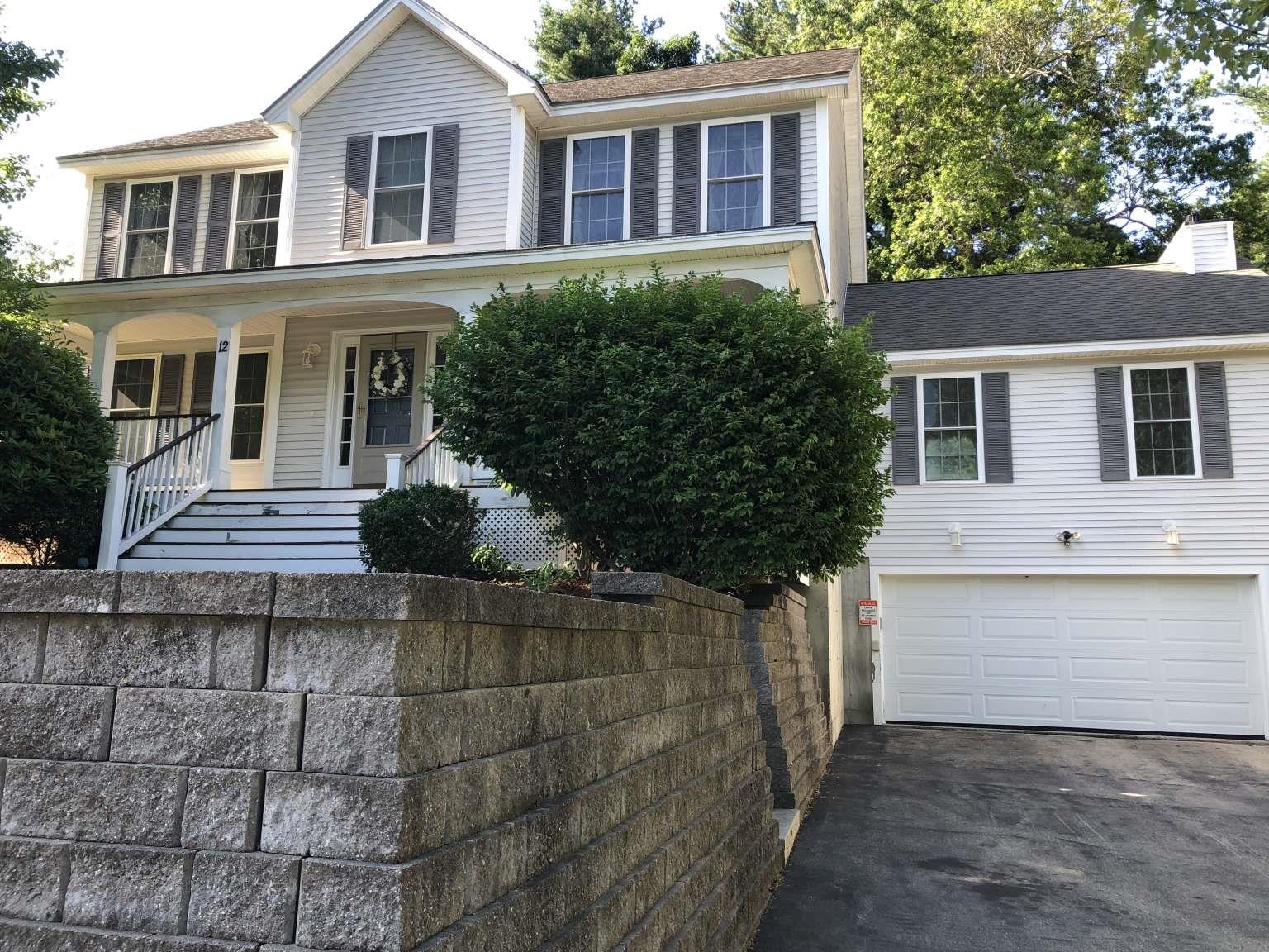 Nestled in the desirable Maplewood neighborhood (home to the newly built McCarthy Middle School, near exit 1 off Rt. 3) this beautiful 4-bedroom, 2.5-bath colonial offers 2,600 square feet of thoughtfully designed living space. A south facing charming farmer’s porch and mature landscaping create instant appeal. The heart of the home is a bright, open-concept area where a granite-accented kitchen flows seamlessly into a cathedral-ceilinged living room featuring a cozy gas fireplace, a perfect space for daily living and entertaining. A dedicated office/study on the first floor offers privacy and versatility for telecommuting, schooling, or creative pursuits. Spacious countertops, tiled bathrooms, central AC, in-floor heating, and a rear deck seamlessly blend modern comfort with classic colonial charm. The spacious unfinished basement is perfect for storage or future customization. Natural gas range, water heater, and a complete appliance package are all included. Utilities include public water, sewer, gas, electric service, and sprinkler system. The bedrooms offer a tranquil retreat, where uninterrupted views of towering trees and open skies invite peace and reflection. A home like this is a rare gem, one that may not be seen again for years to come. Showing by appo. only. The assigned middle school is McCarthy Middle School, not Elm Street Middle School as mentioned below.