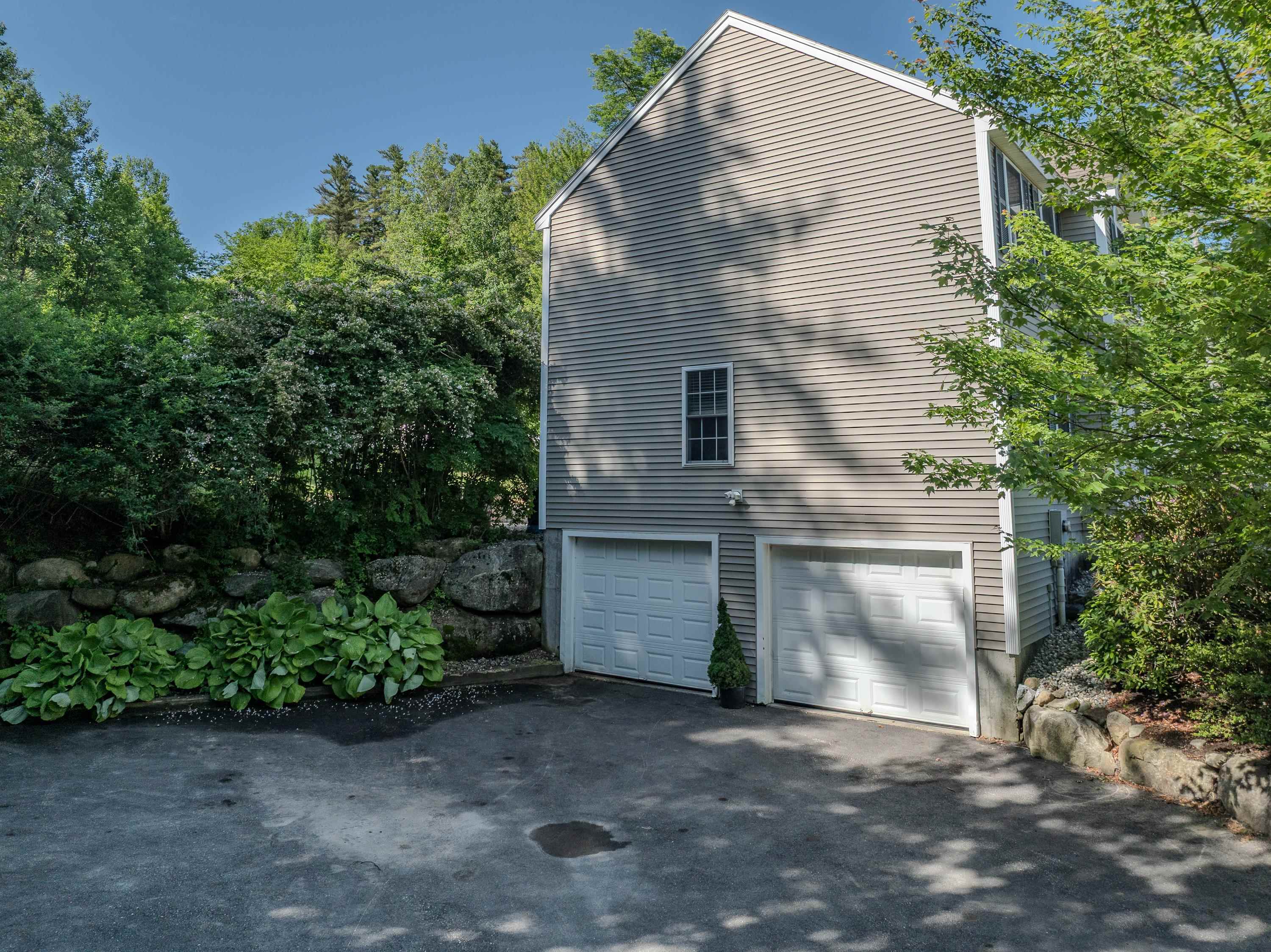 Paved driveway & 2-car under garage