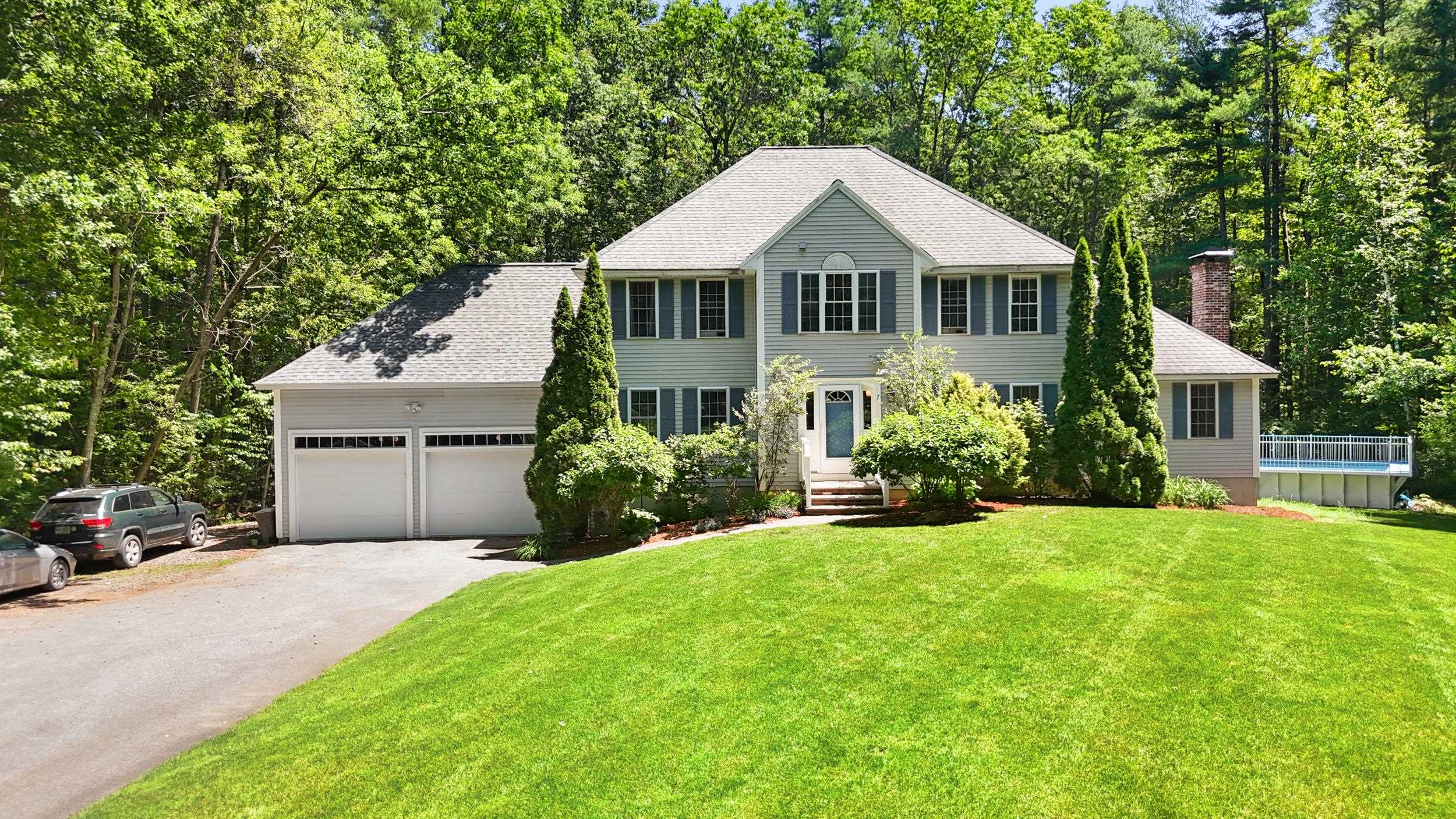 This tastefully built Colonial served the owners well and is now ready for you! As you enter the home, the spacious and welcoming foyer sets the tone for this beautiful home. The first floor features a large office space with beautiful custom built-ins, as well as a first floor en suite perfect for in-laws or multigenerational living. The large eat in kitchen is a cook’s dream with sleek stainless-steel appliances, 9.5-foot island and granite countertops. The kitchen opens into the great room where you will find a cozy fireplace with wood stove insert, and plenty of space for entertaining. The formal dining room off the kitchen also provides more space for entertaining. Finishing off the first floor is a 3-season room overlooking the expansive backyard. Upstairs you will find another three or four bedrooms plus a primary suite with a whirlpool tub perfect for relaxing after a long day. The basement has been finished and is a blank slate for your home gym, media room or more office space and plenty of storage. Rounding off this stunning home is a two-car garage with entry into the kitchen area. This home sits beautifully on a professional and very private landscaped lot and includes an above ground pool for those hot summer days! Open Houses Saturday, June 28, 10 am - 12pm and June 29, 11 am - 1 pm.