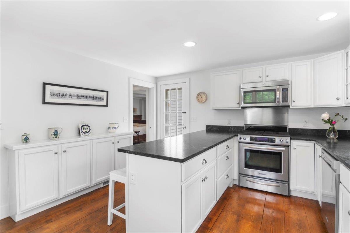 Back Door Off Of KItchen Leads Opens To Grilling Area