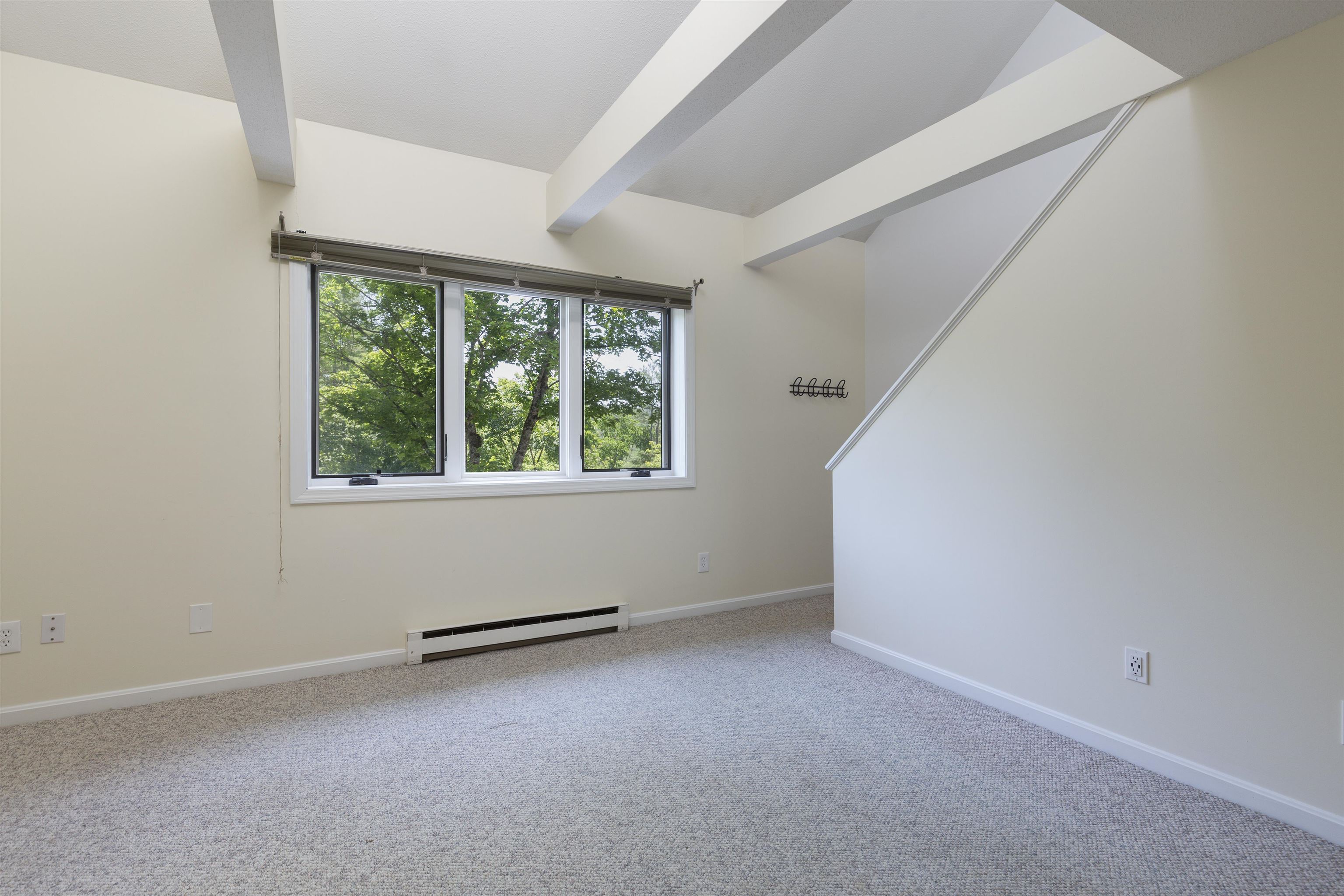 Primary Bedroom with stairs to Loft
