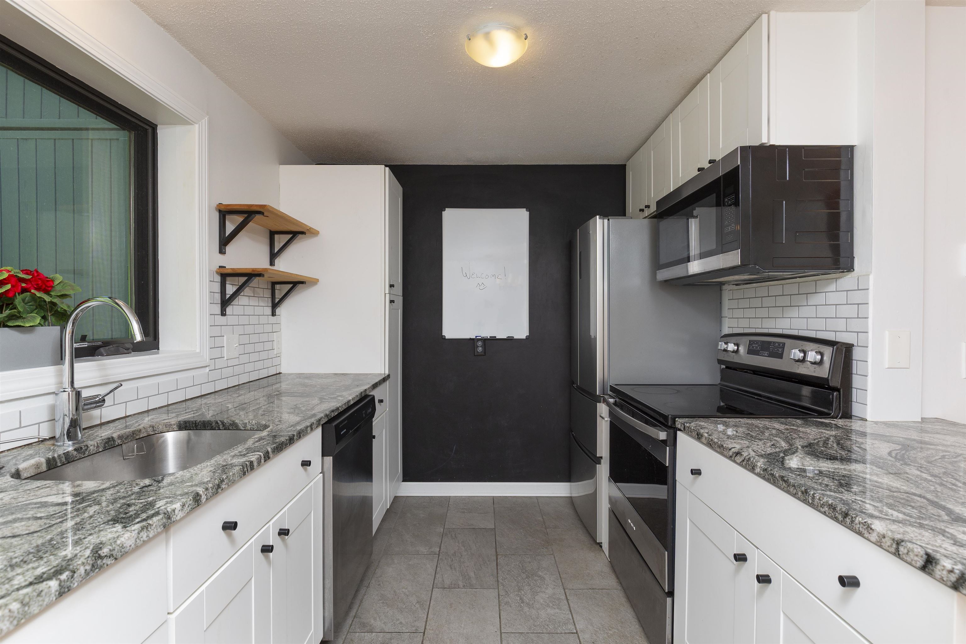 Updated Kitchen with Stainless Appliances and Granite Countertops