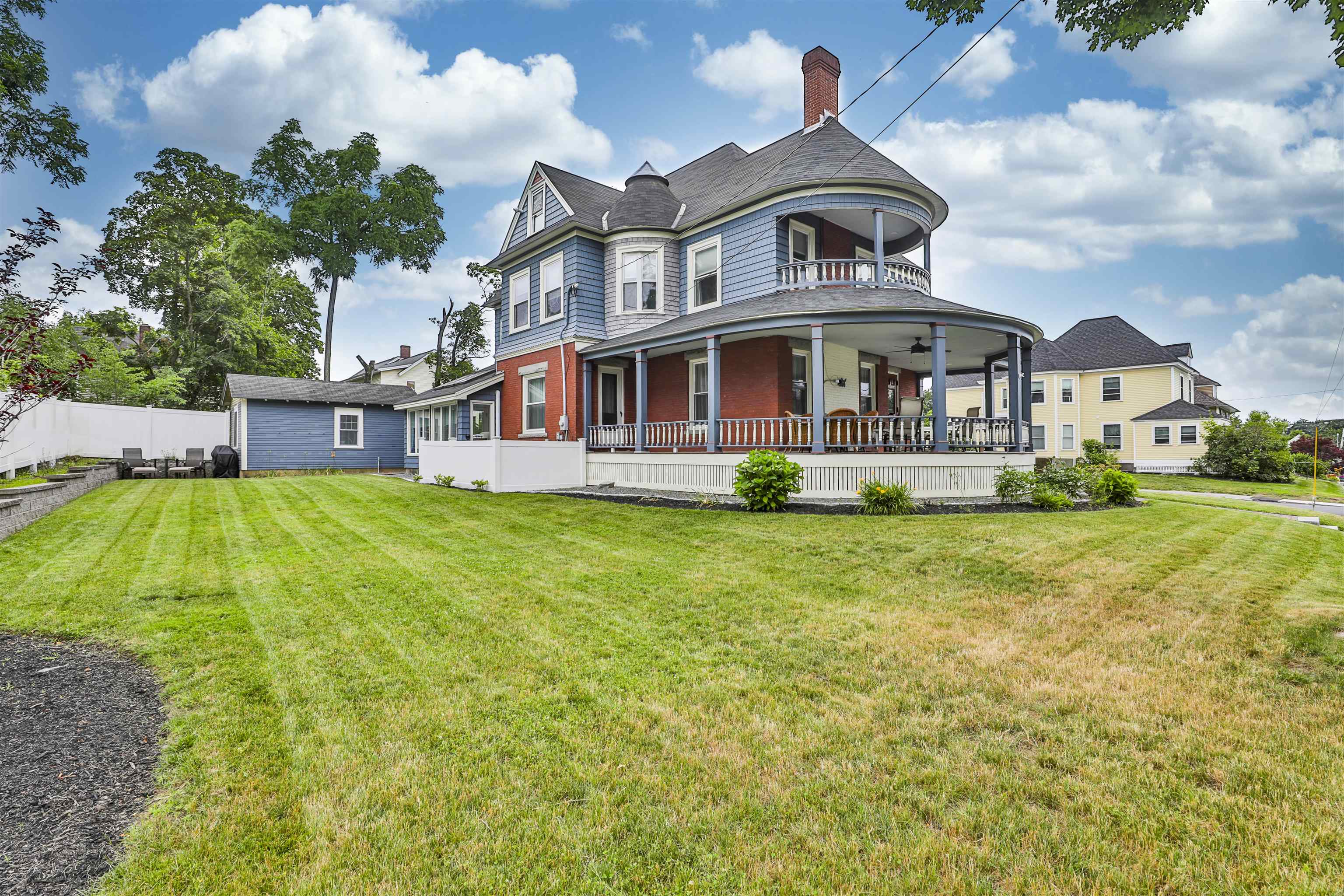 Tucked into the heart of Nashua, this COMPLETELY RENOVATED Victorian is a masterclass in blending timeless charm with modern luxury.  Originally built in 1900, this home has been meticulously reimagined from the inside out offering the elegance of a bygone era with the comforts of today.  From the moment you step onto the rebuilt wraparound porch, you are greeted by craftsmanship that honors the home's historic roots.  Inside the transformation is breathtaking: impeccably finished hardwood floors, gourmet kitchen with high-end appliances and three beautifully updated bathrooms.  The home boasts of new energy-efficient windows, spray foam insulation with over 3,400 sq ft of living space, the layout is as functional as it is beautiful.  The new 200 AMP electrical service, central air, no detail has been overlooked.  It's not just a house - it's a love letter to Victorian architecture, rewritten for modern life.  Absolutely beautiful!