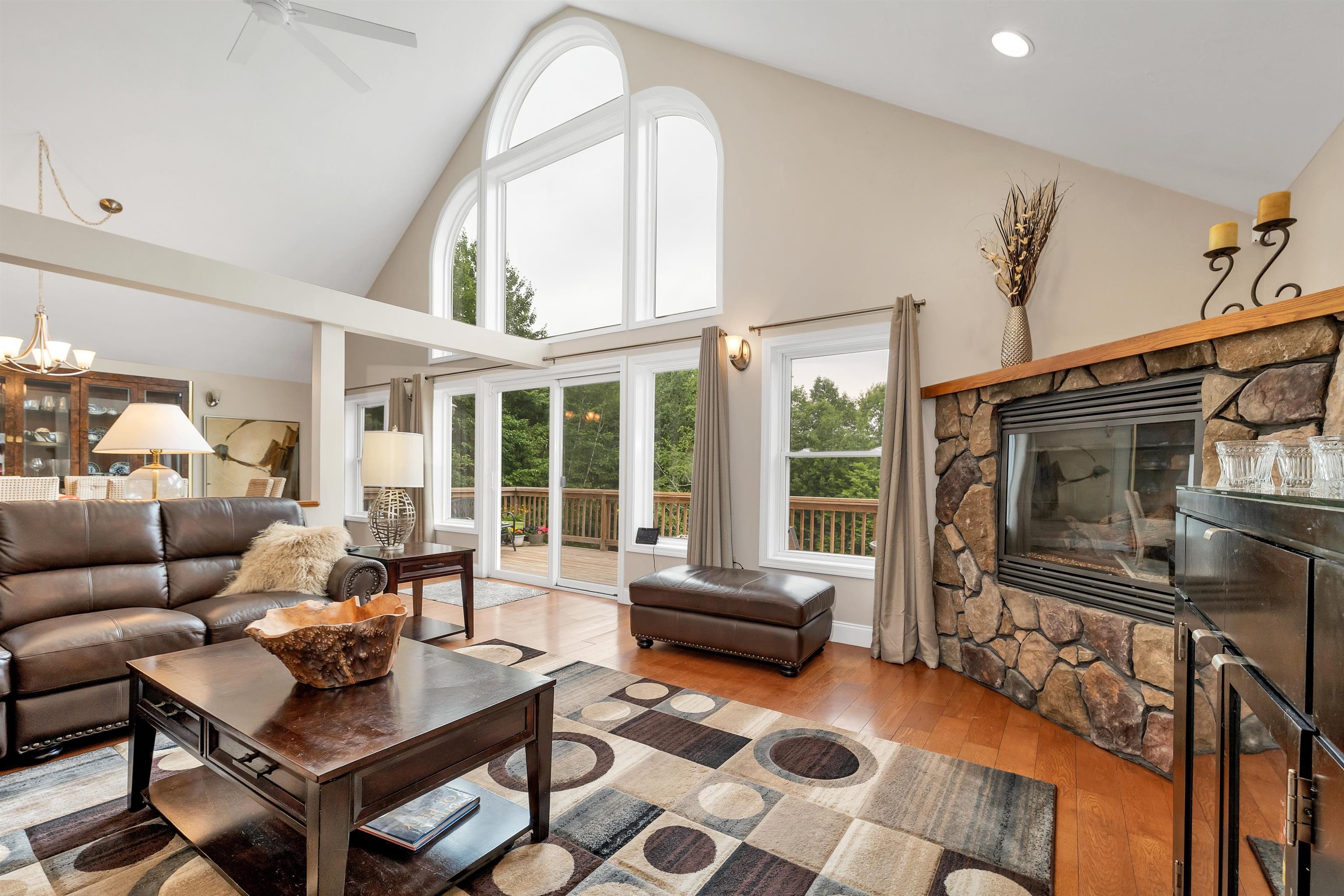 THE DOORS OPEN ONTO A 44 FOOT LONG DECK WHICH OVERLOOKS THE LOVELY BACK YARD.