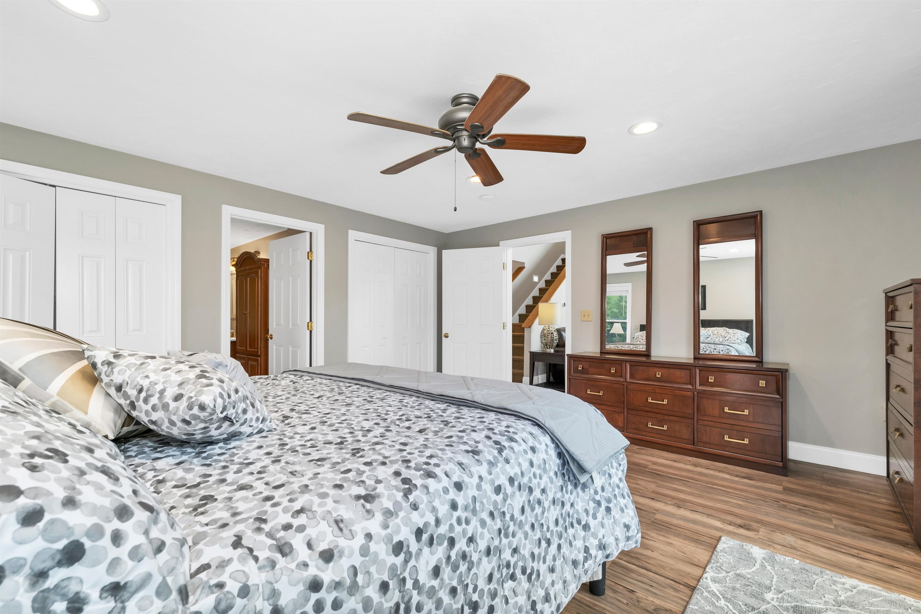THERE ARE FOUR CEILING FANS IN THE HOUSE, INCLUDING ALL THE BEDROOMS.