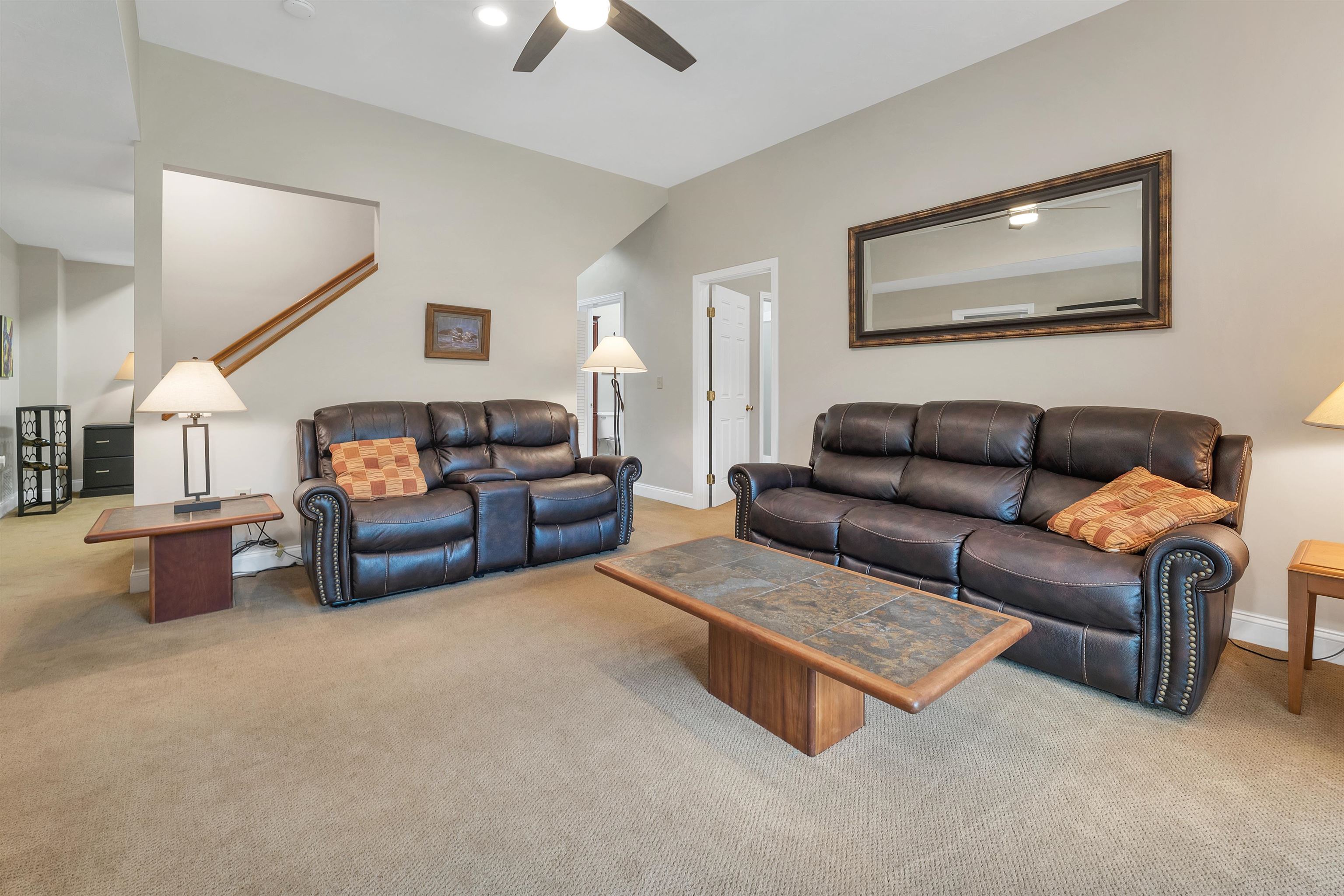 THERE IS A STAIRWELL BETWEEN THE FOYER AND LIVING AREA TO THE LOWER LEVEL.