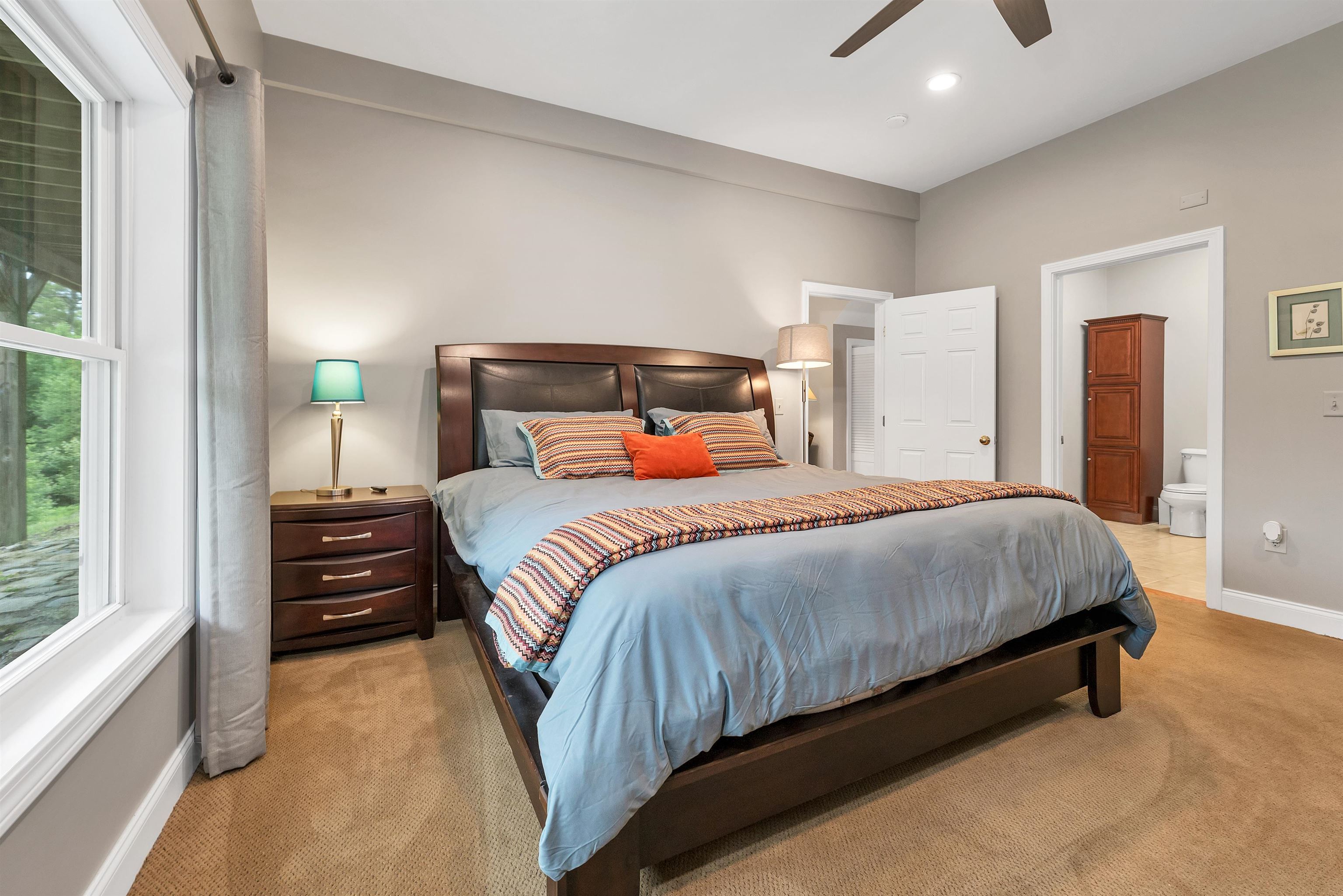 THE BEDROOMS HAVE LARGE WINDOWS FOR NATURAL LIGHTING.