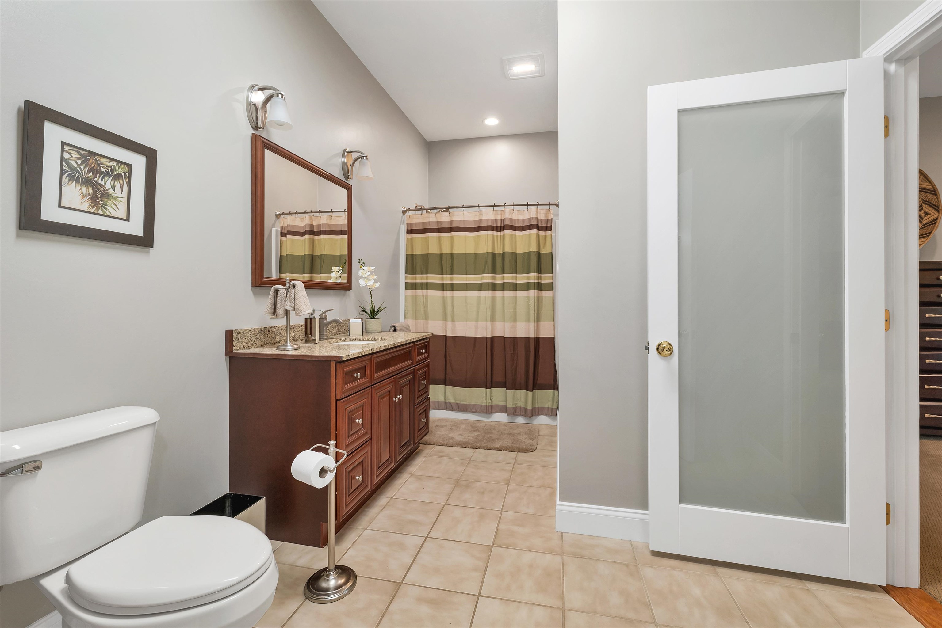 ONE OF THE BEDROOMS HAS A NEW OPAQUE WINDOWED DOOR INTO A SECOND FULL BATHROOM.