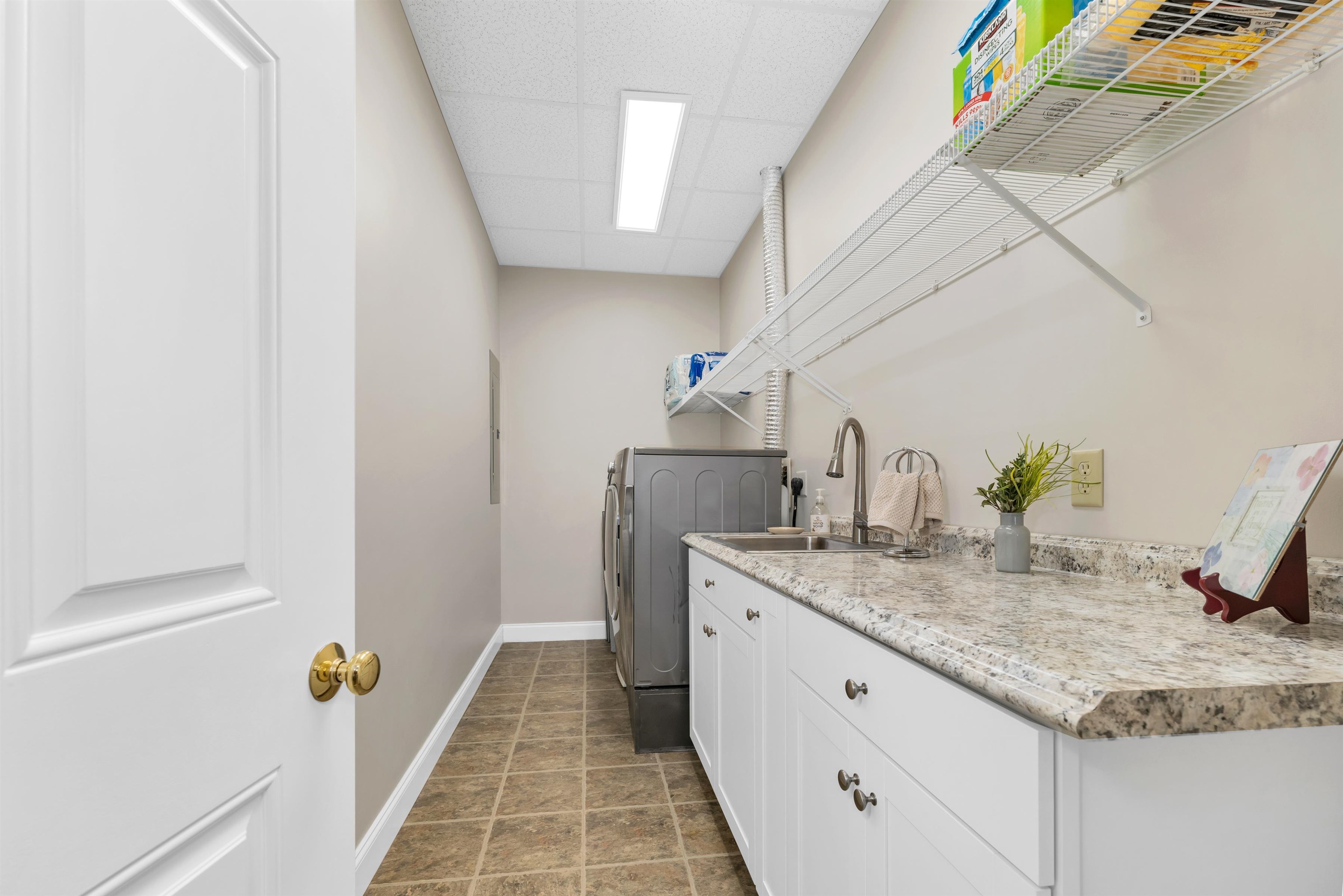 APPLIANCED LAUNDRY ROOM WITH FOLDING COUNTERS,