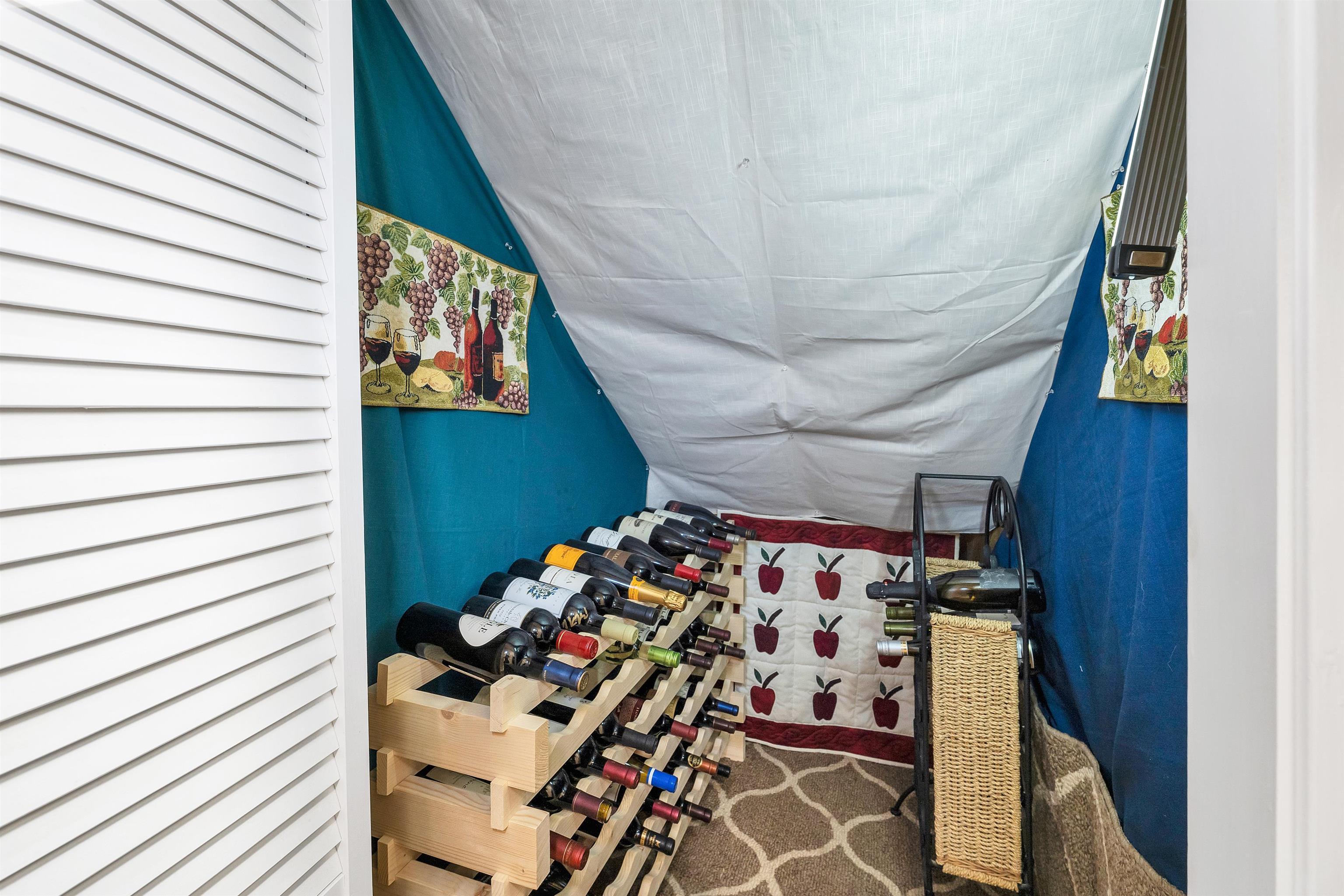 UNDER THE STAIRWELL IS EVEN A WINE CLOSET. FINISH THE WALLS & CEILING AND IT IS PERFECT!