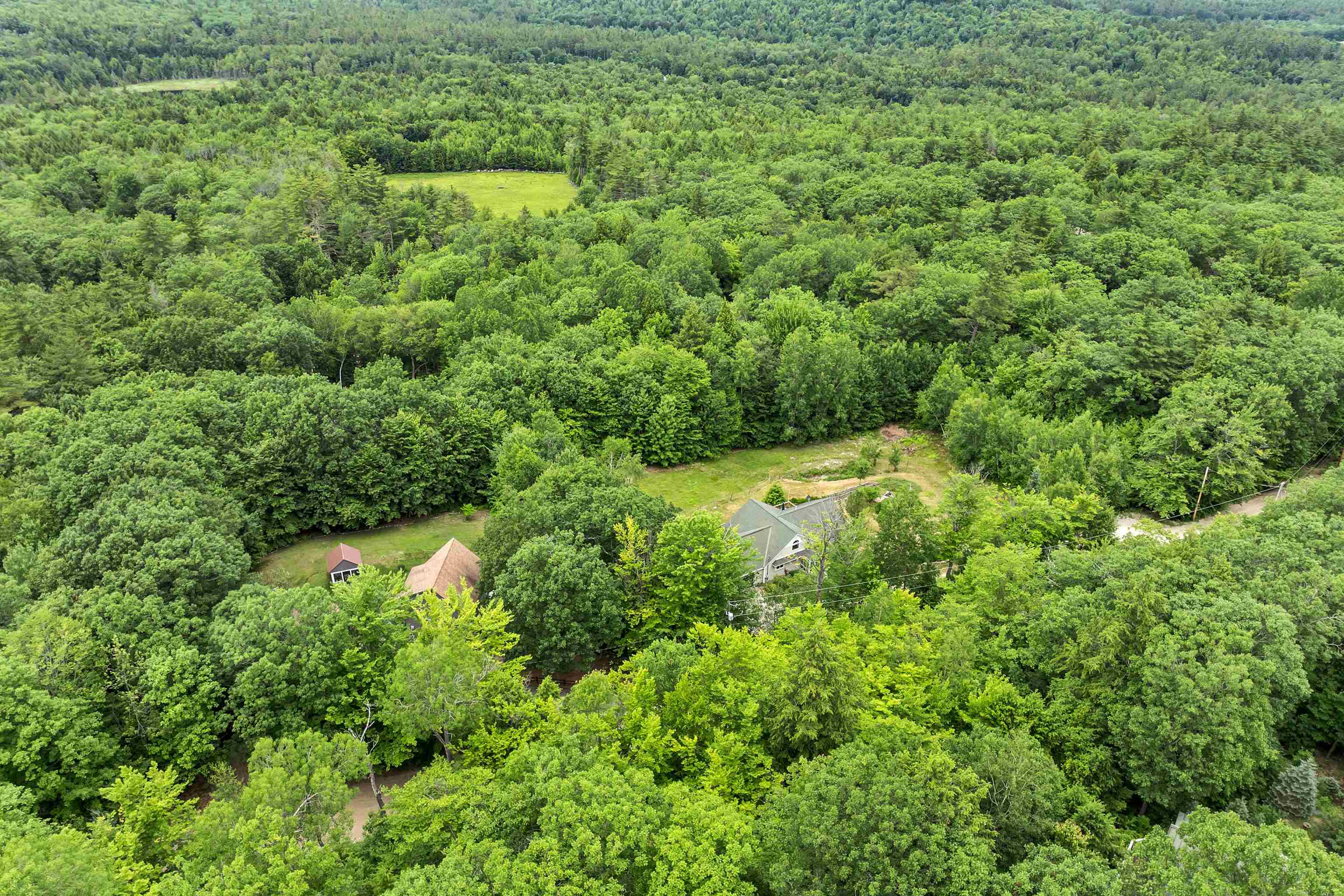 THE PROPERTY INCLUDES VEGETABLE AND PERENNIAL GARDENS. . .