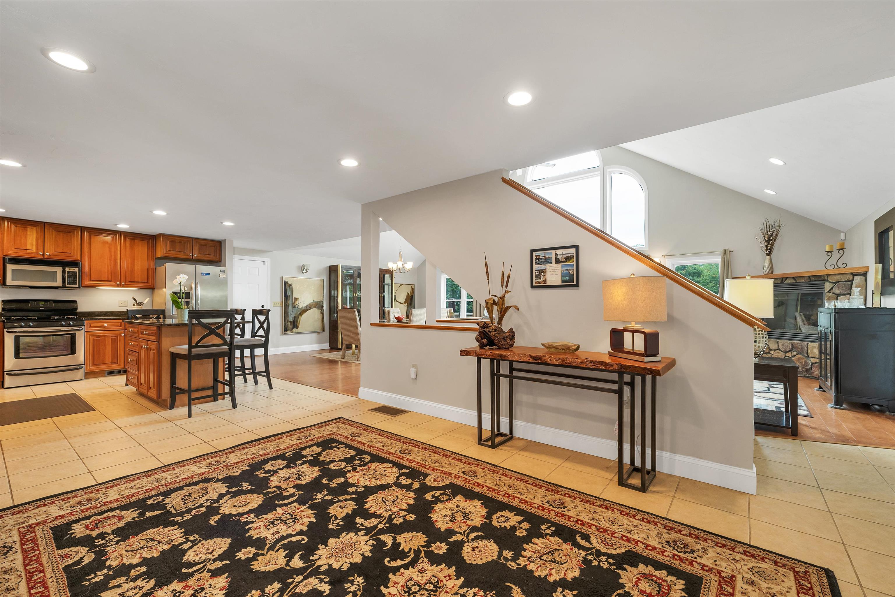TO THE LEFT IS A GREAT CHERRY CABINETED KITCHEN WITH GRANITE COUNTERS. . .