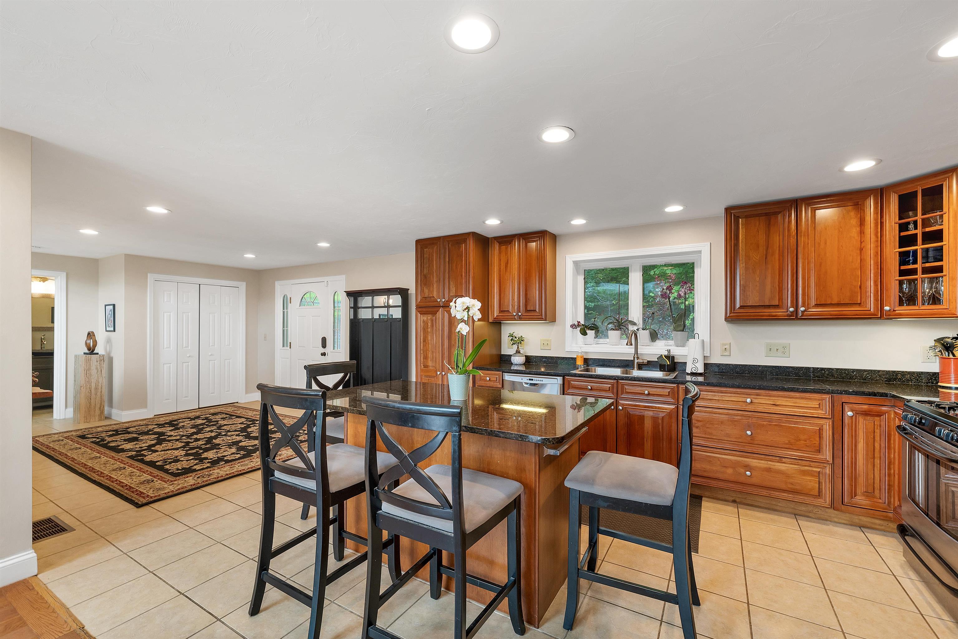 THERE IS AN ABUNDANCE OF CABINETS, INCLUDING A PANTRY, AND. .  .