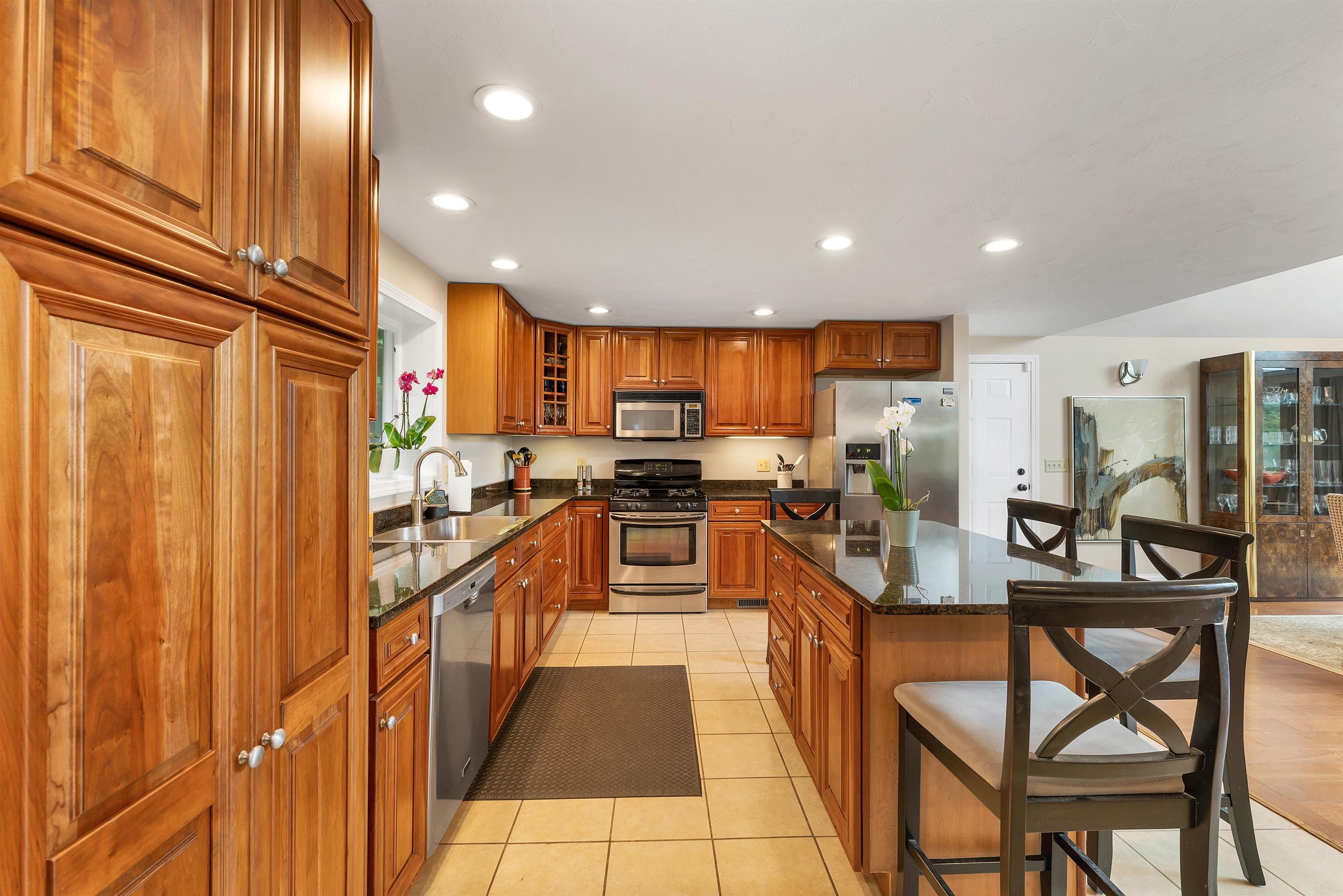 LOTS OF DRAWERS, GREAT APPLIANCES, AND MORE TILE FLOORS.