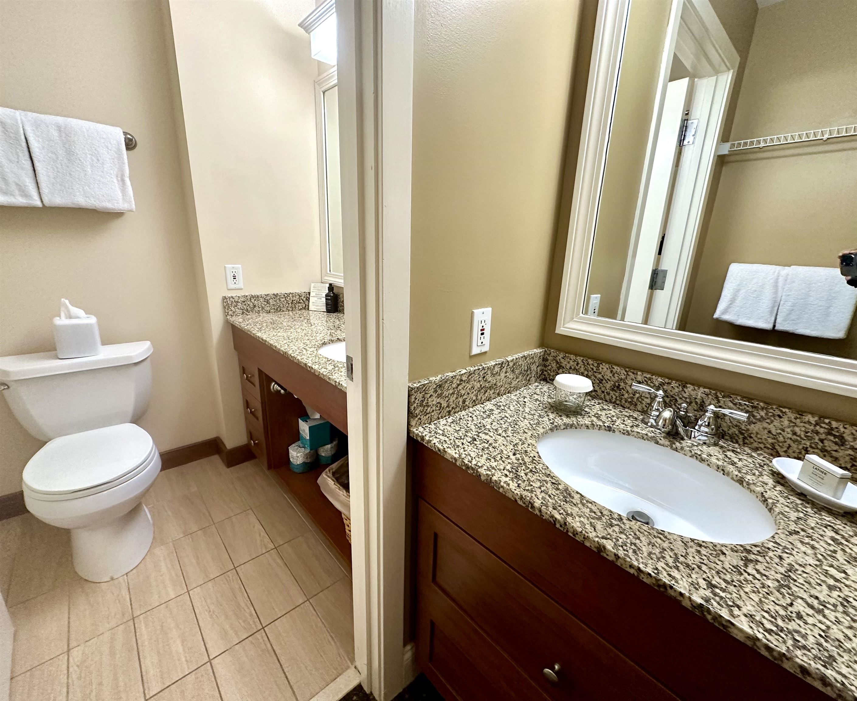 Two bathrooms with outer sink area