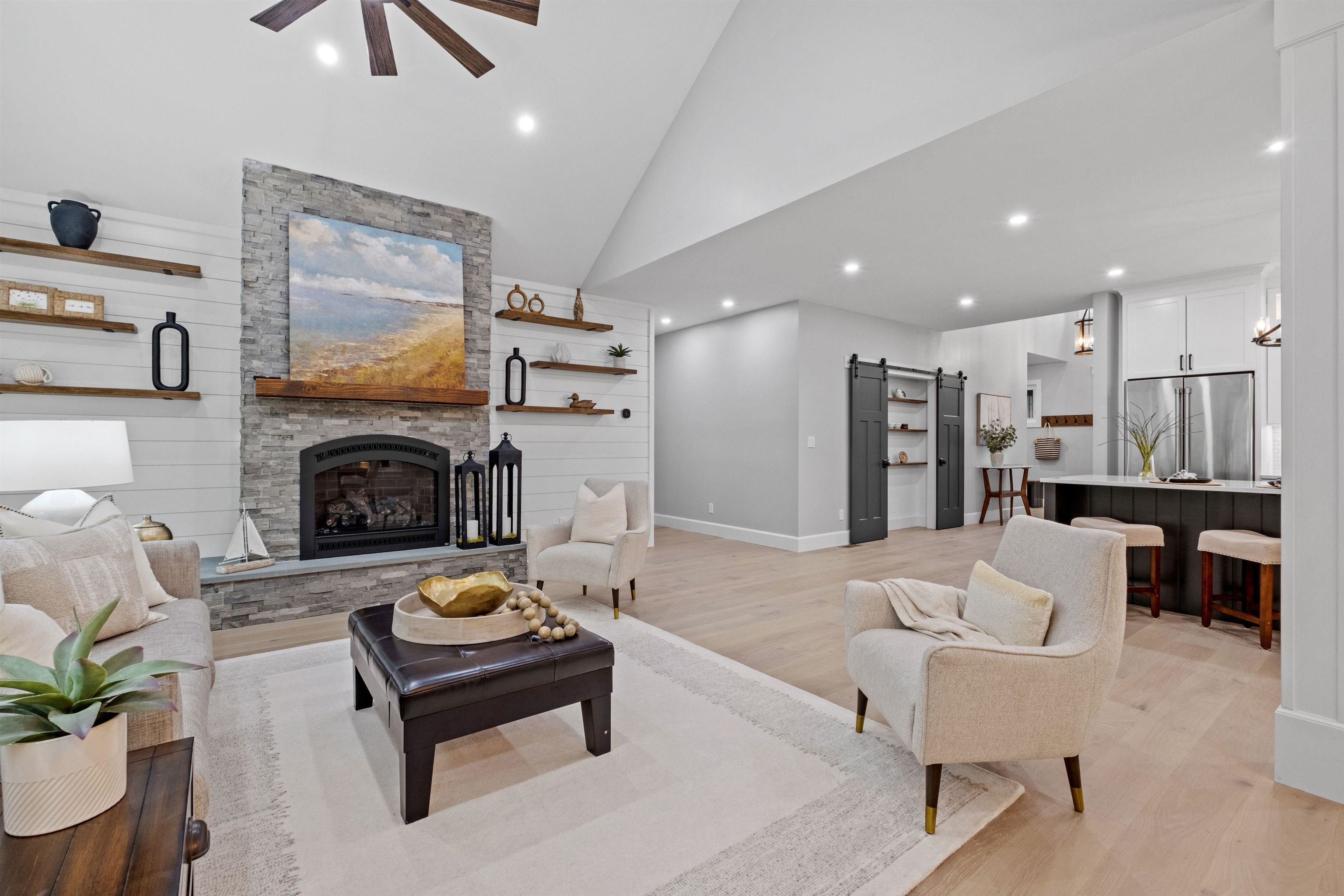 Stone floor to ceiling gas fireplace