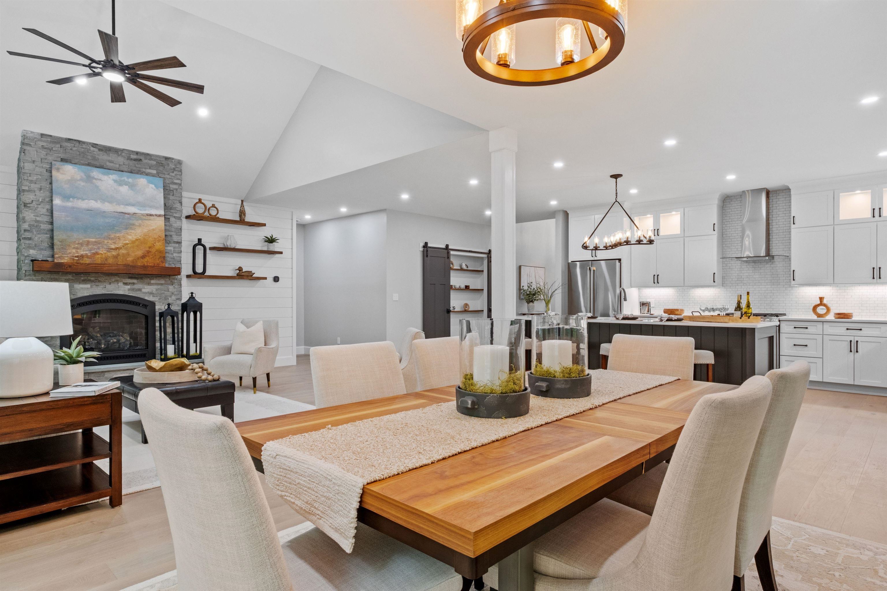 Dining area right off kitchen and living area, with french doors opening to screened-in porch