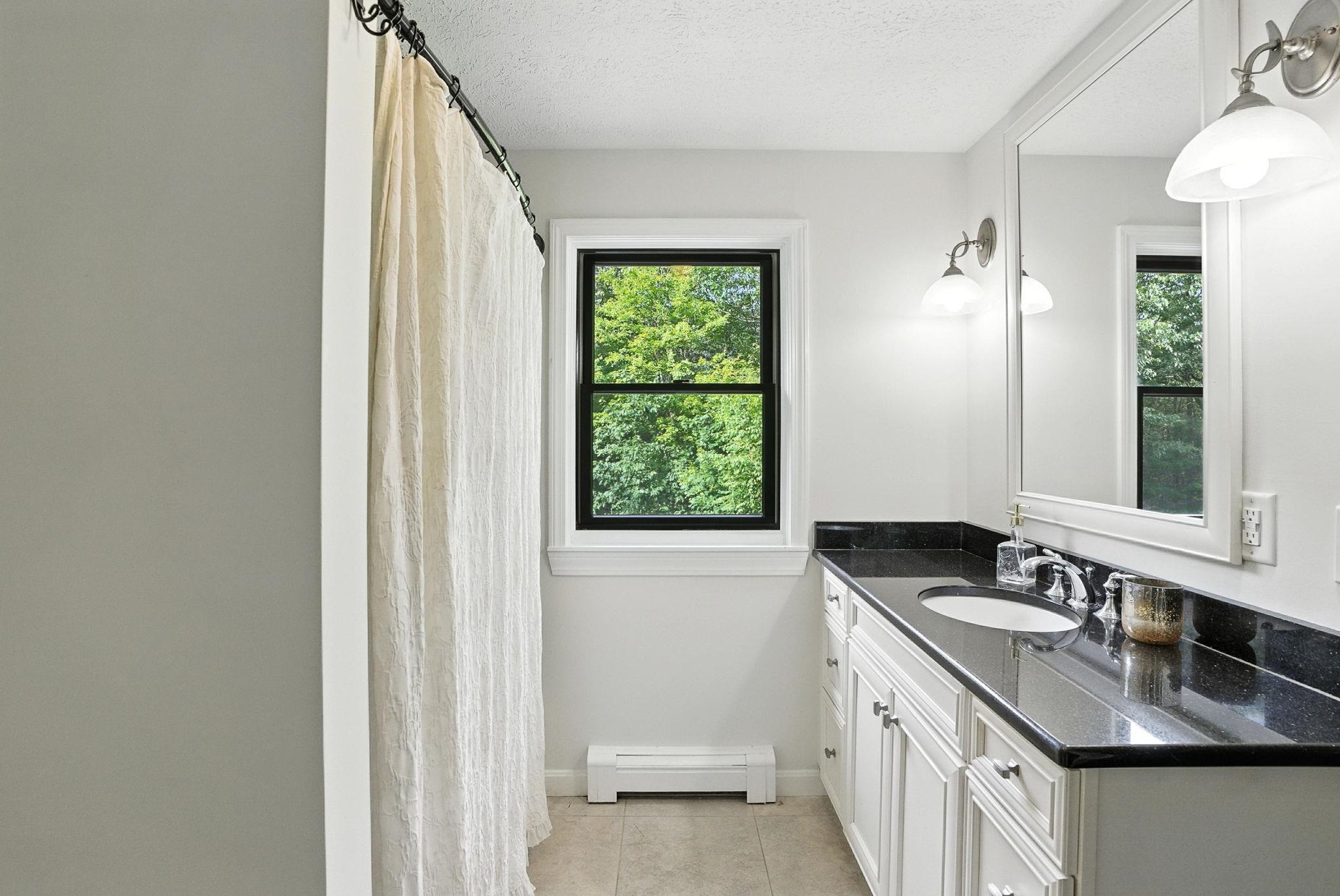 Granite Surfaces in Guest Full Bath