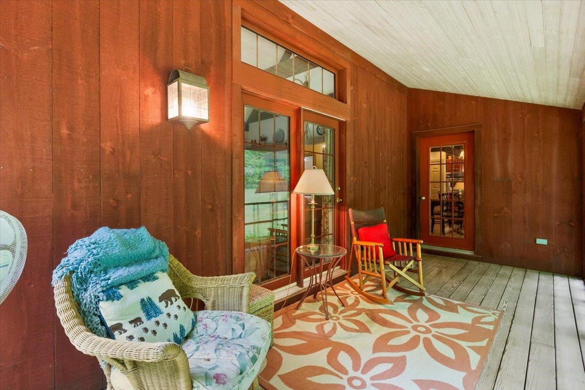 Door to living room, and kitchen, from screened porch