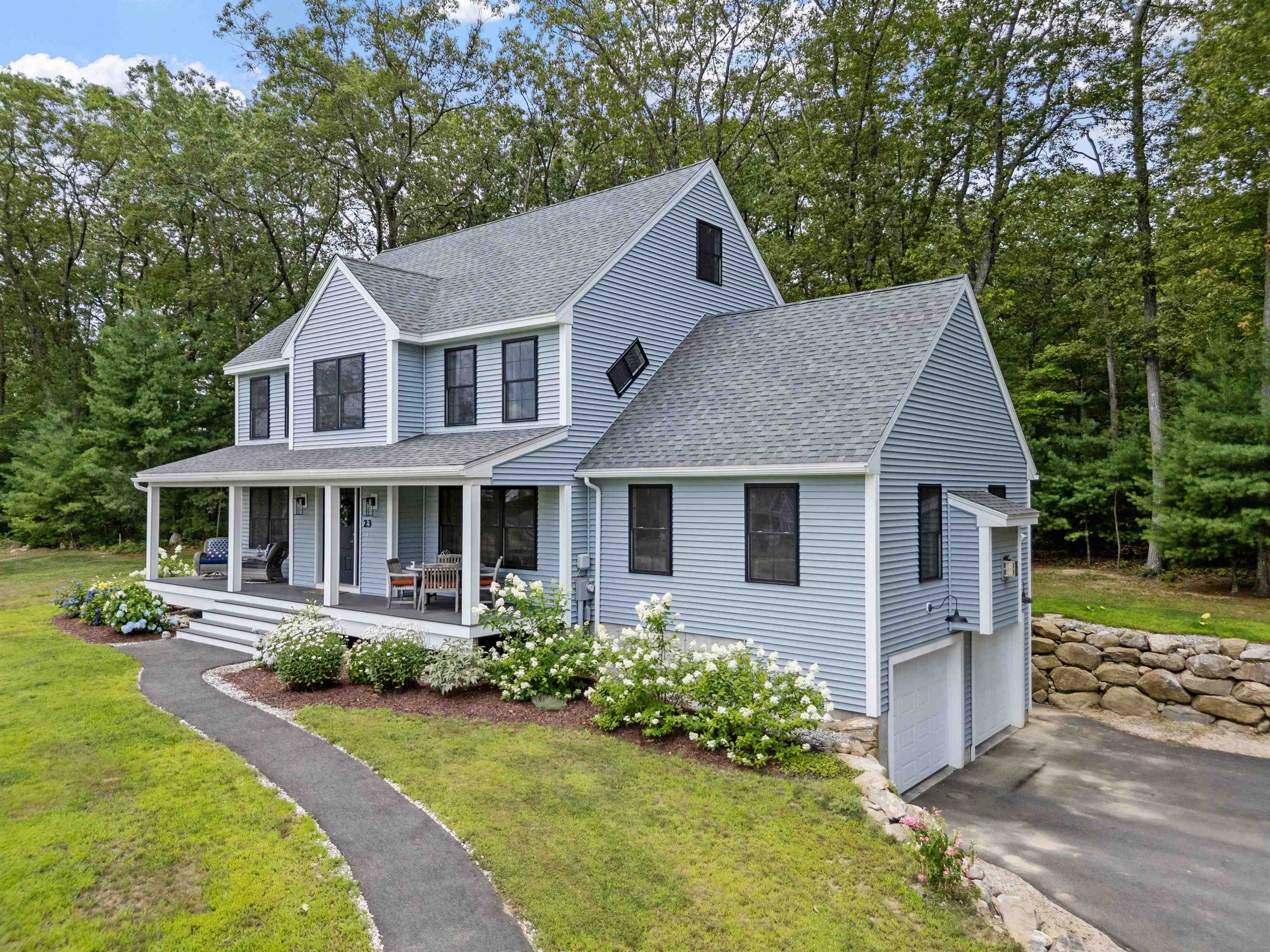 Built in 2022 and located on a small cul-de-sac, this beautiful, like-new Colonial features 10 foot ceilings, hardwood floors and natural light throughout. Outside, sleek black windows and an expansive farmer's porch with composite flooring greet you and your guests. Start your day with coffee on the porch or end it with dinner and a cocktail. Step inside, and you'll be wowed by the eat-in chef's kitchen complete with gas range, oversized maple island perfect for gathering or setting out buffets, quartzite countertops, abundant cabinetry, built-in coffee/beverage bar and professional stainless appliances with transferable warranties. Slider from the kitchen leads to a composite rear deck ideal for summer fires or bird-watching. A living room with French doors, oversized family room with gas fireplace,  and dining room complete the 1st level. Upstairs, the house offers a large primary suite with tray ceiling, gorgeous tiled bath and walk-in closet. There are 2 additonal bedrooms on the 2nd level as well as a convenient office. Need additional space? The large attic, complete with full-sized windows, or the basement are ready for your finishing ideas. Home offers central air, fire suppression and water filtration systems, tankless water heater, gutters and more. Visit today and make this curated house your next home! Open Houses Saturday 7/19 from 10-12 and Sunday 7/20 from 11-1.