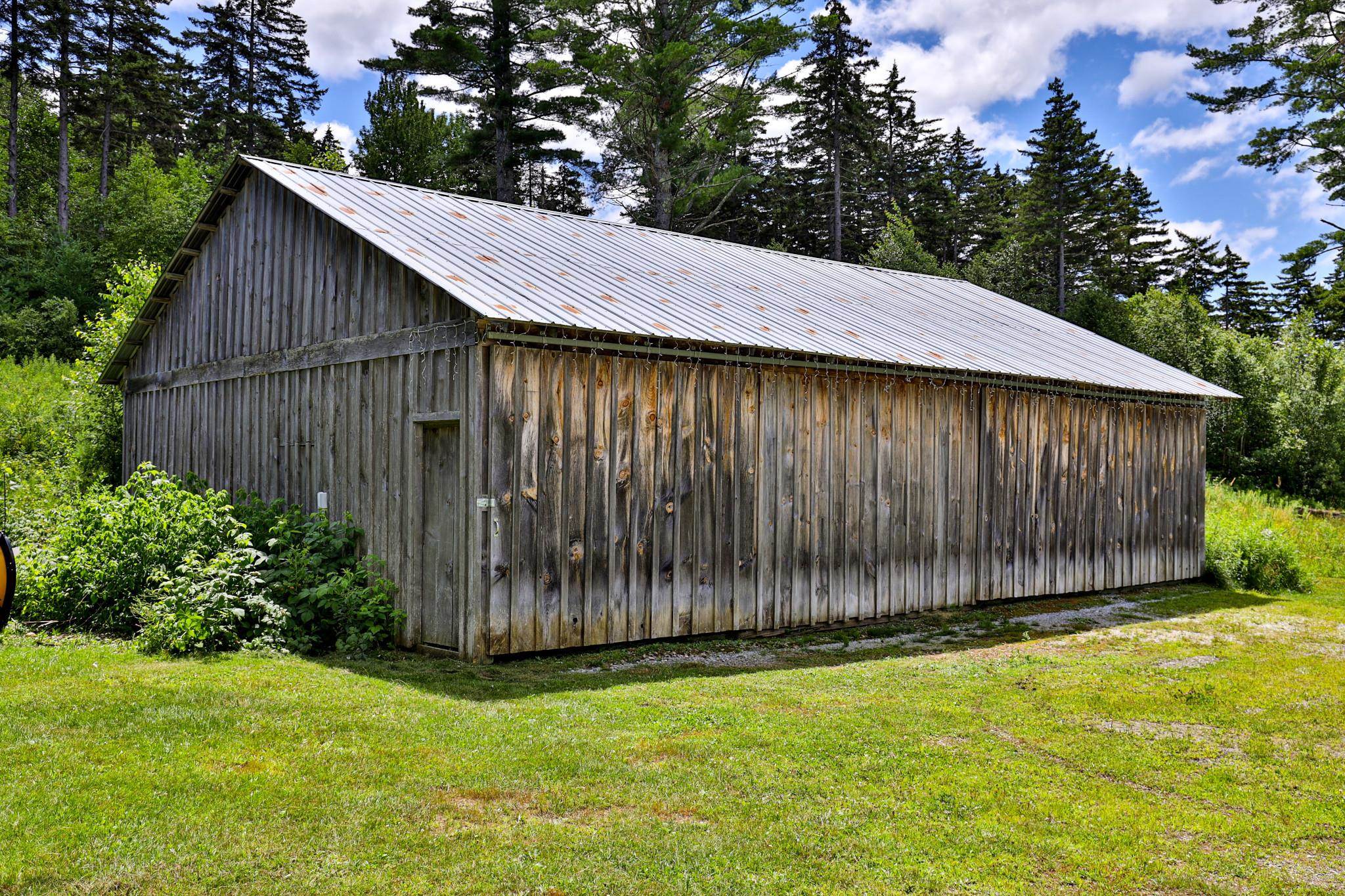 Rustic barn for vehicles and storage