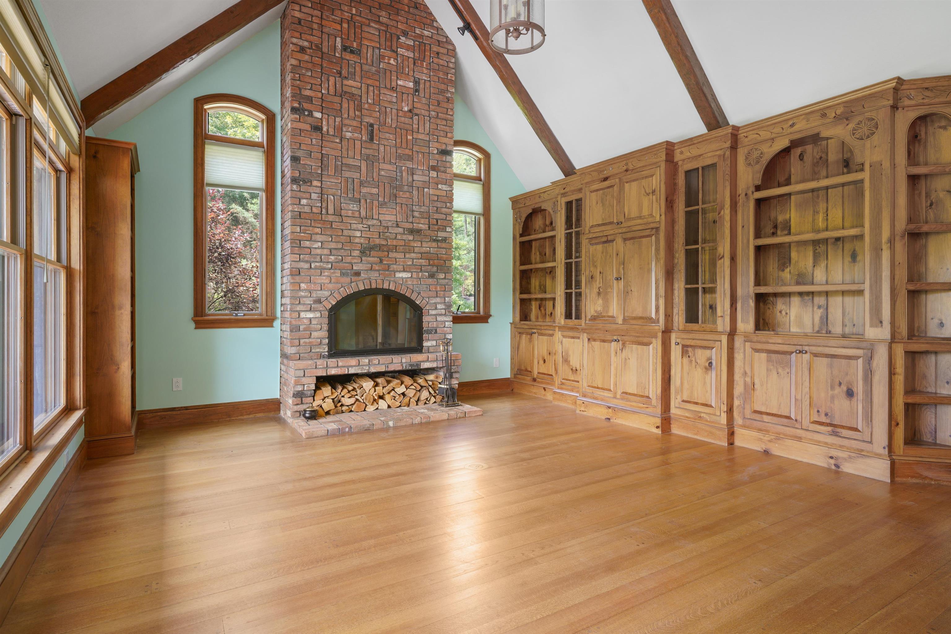 den with built in book shelves and cabinests