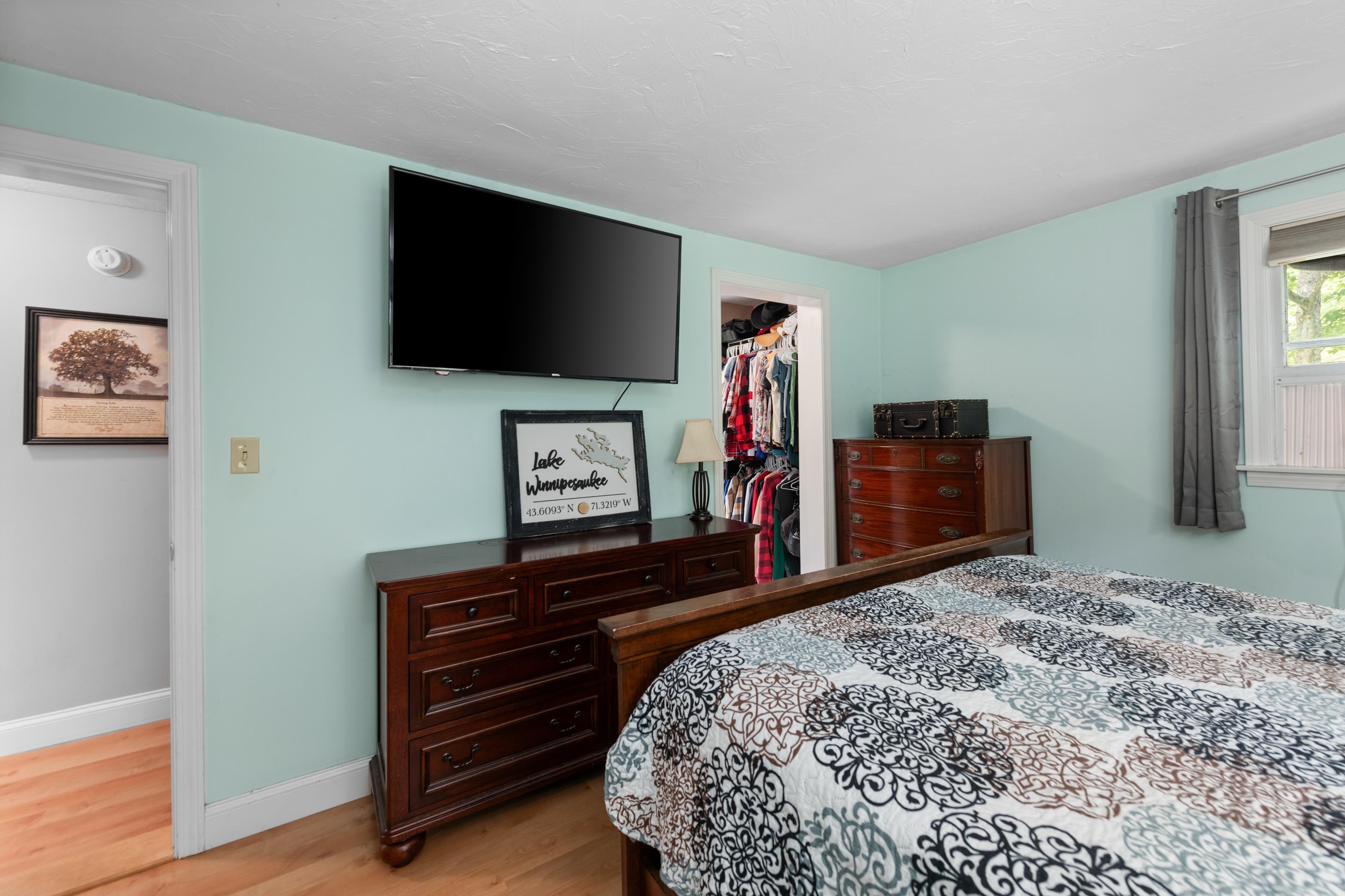 The primary bedroom door to the right leads you to the closet and then bathroom