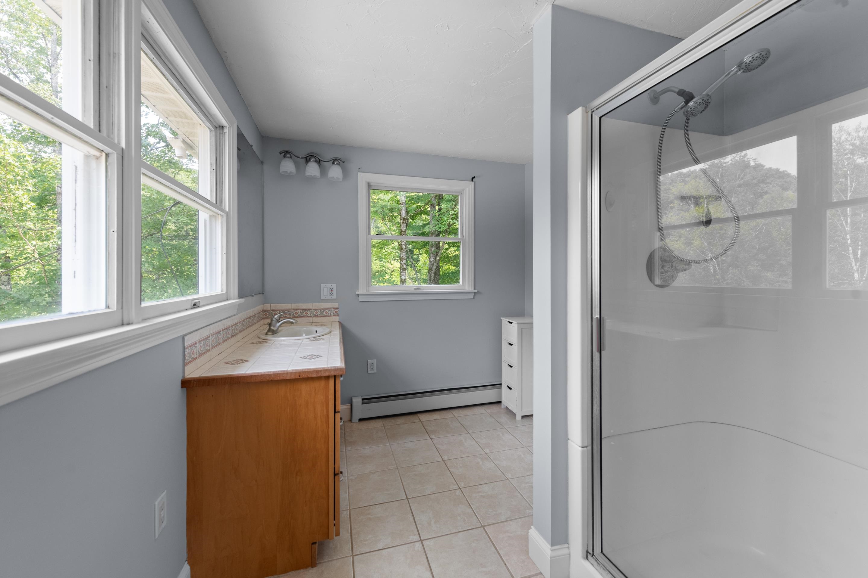 Primary bathroom with a sink and shower