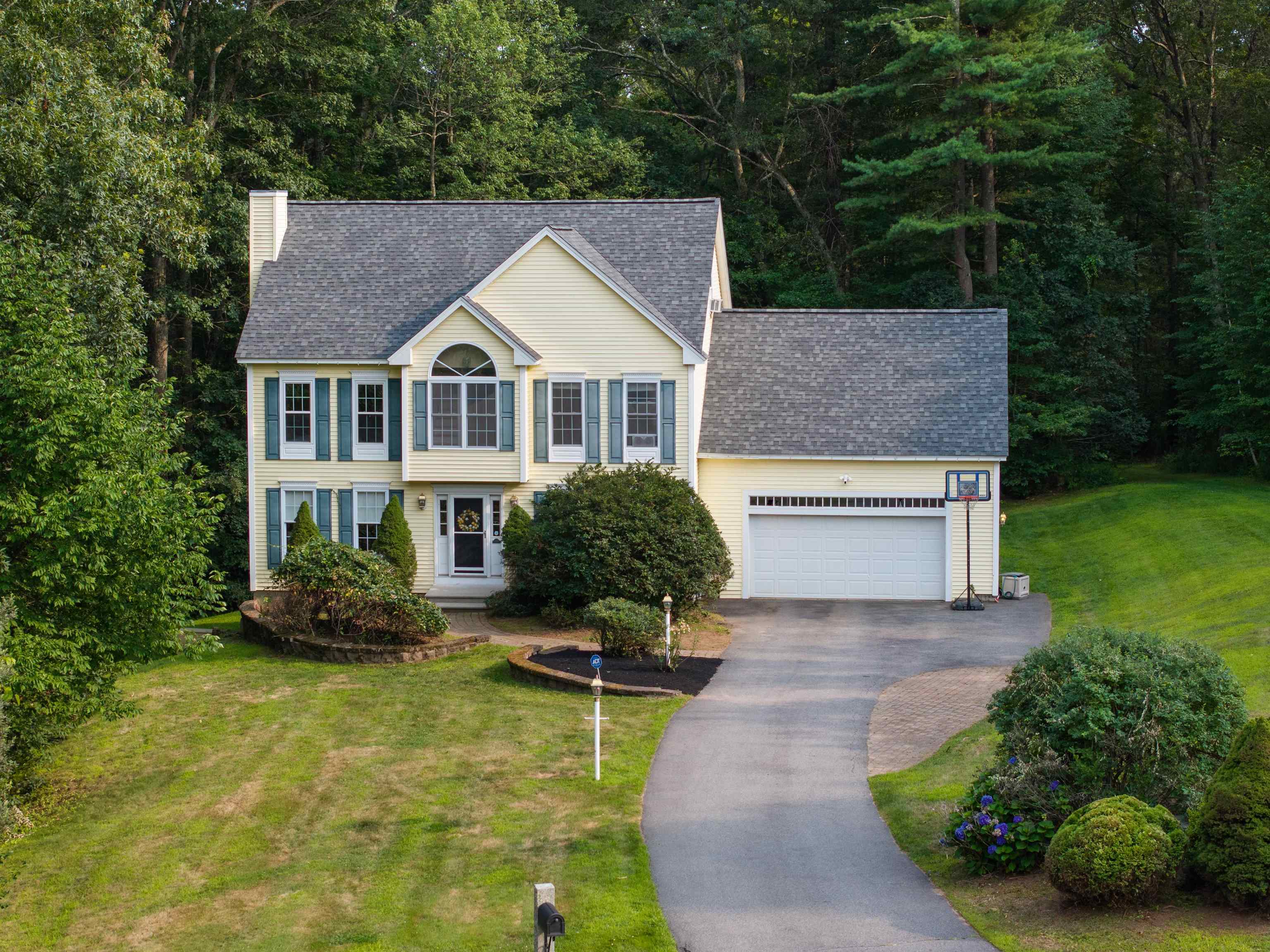 This beautiful 4-bedroom, 3-bathroom home in one of Windham’s most sought-after cul-de-sac neighborhoods has been thoughtfully updated for peace of mind and long-term value, featuring a brand-new roof installed just one month ago, a newer septic system, a radon mitigation system, and a comprehensive water treatment system. Set just a short walk from Griffin Park — widely considered the crown jewel of New Hampshire parks — this spacious home offers the perfect blend of comfort, convenience, and flexible living space. Step into an inviting family room centered around one of two cozy gas fireplaces. Upstairs, you’ll find four generously sized bedrooms including a sunlit and expansive primary suite, while the third floor boasts a large bonus room that can be used as a guest suite, playroom, or easily converted into two additional bedrooms. The walkout basement offers excellent potential for finishing and expanding your living area even further. Located minutes from I-93 and just a short drive to Cobbetts Pond and Windham’s highly rated schools, this move-in ready home delivers space, lifestyle, and lasting value in a prime location.