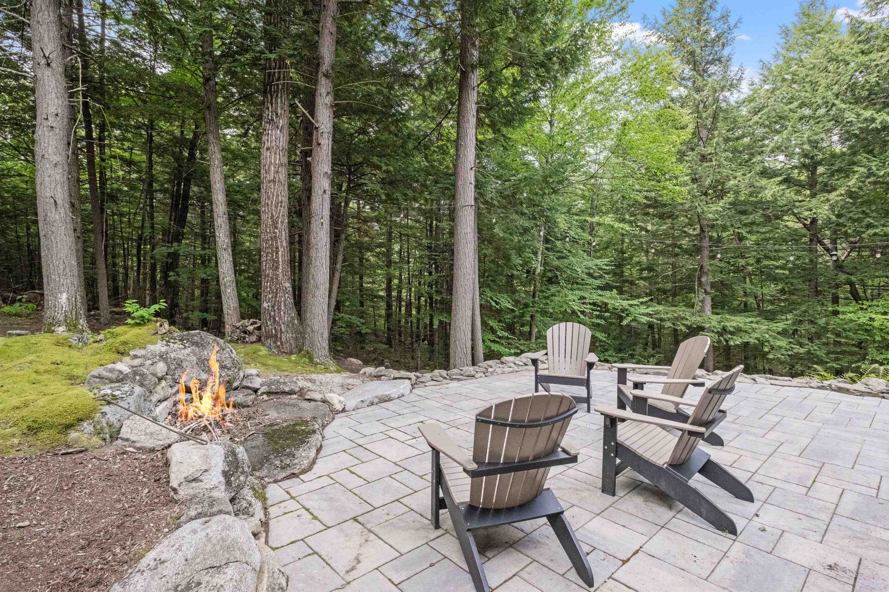 Stone deck with firepit 23855688