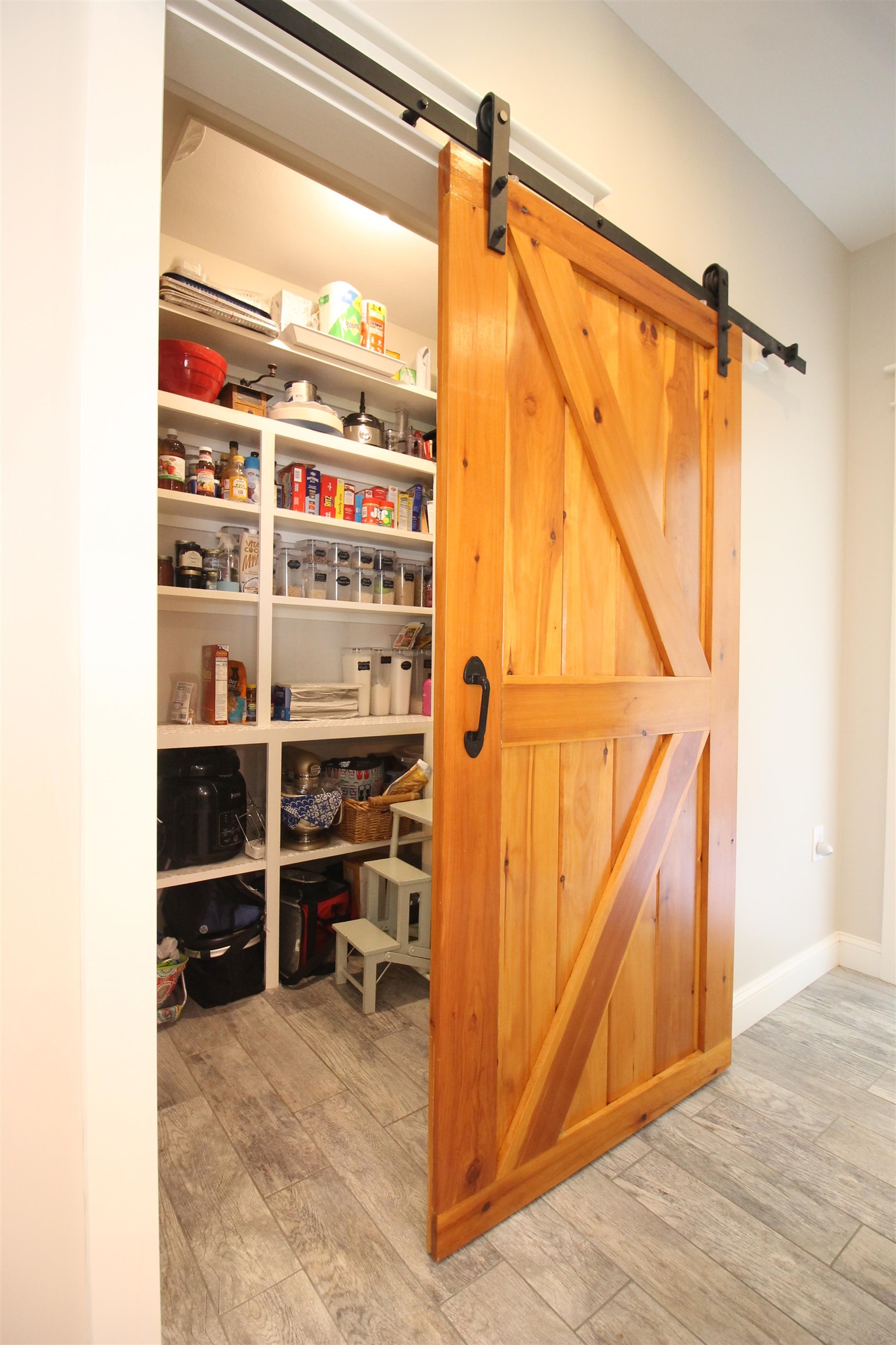 Nicely hidden full pantry