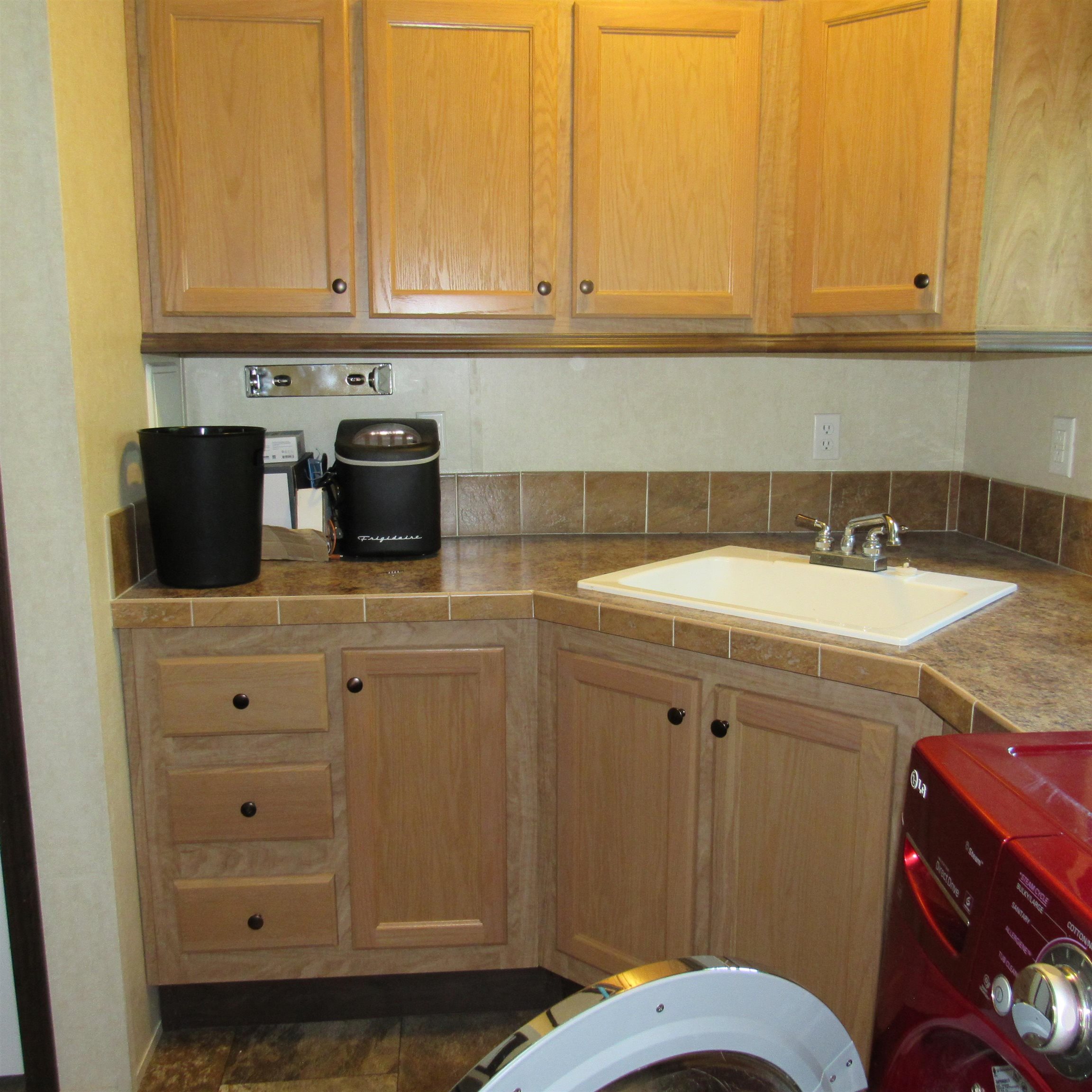 Laundry Room w/ cabinets & sink. 23856678