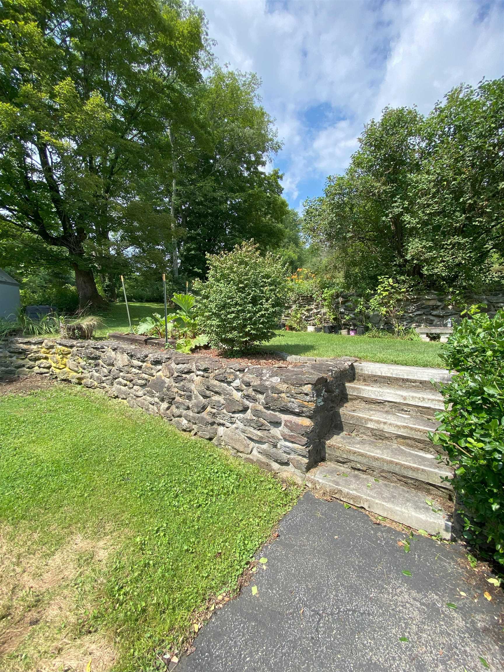 Stone Wall & Steps to Acreage in Back