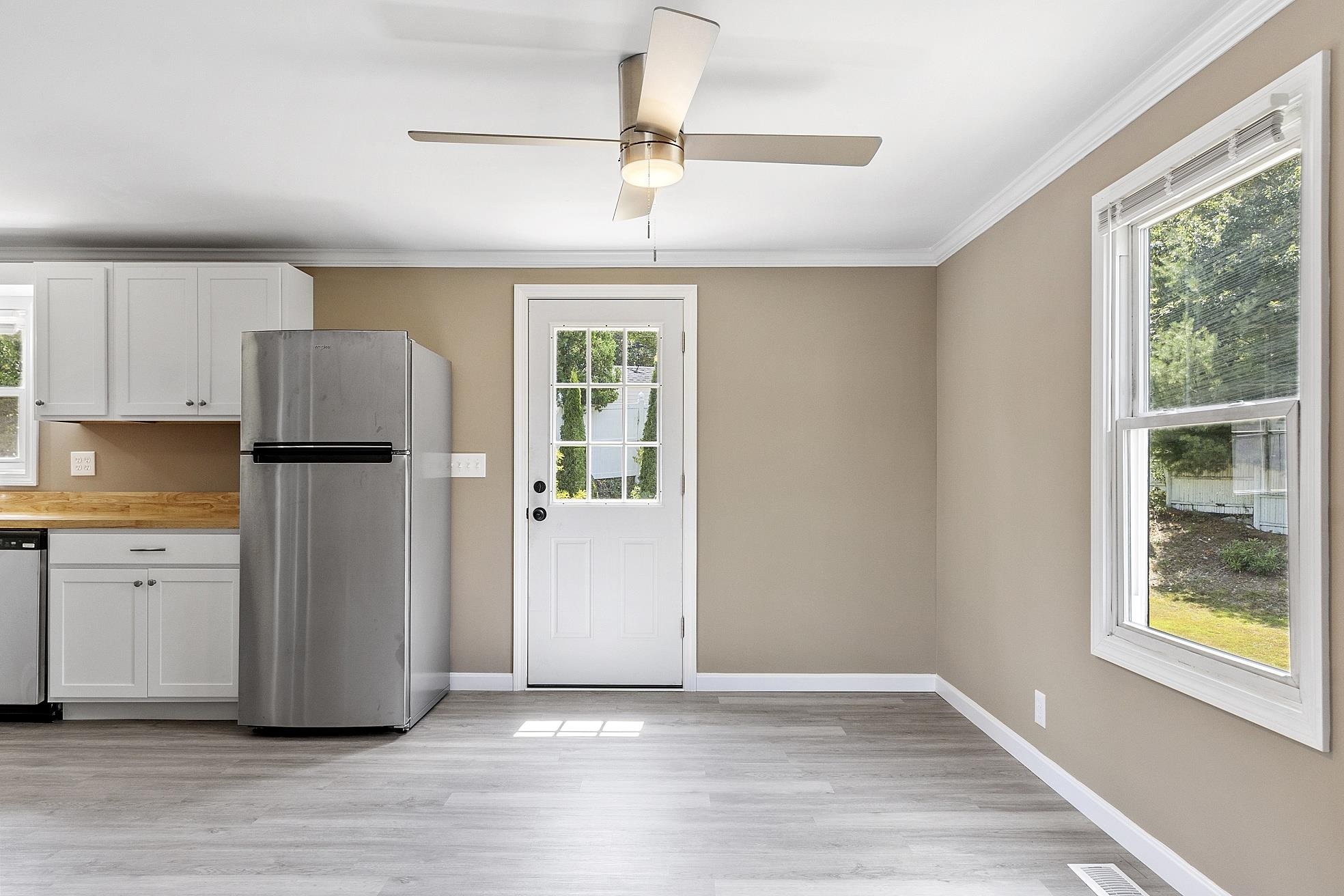 Eating area in Kitchen and door to the deck 23870689