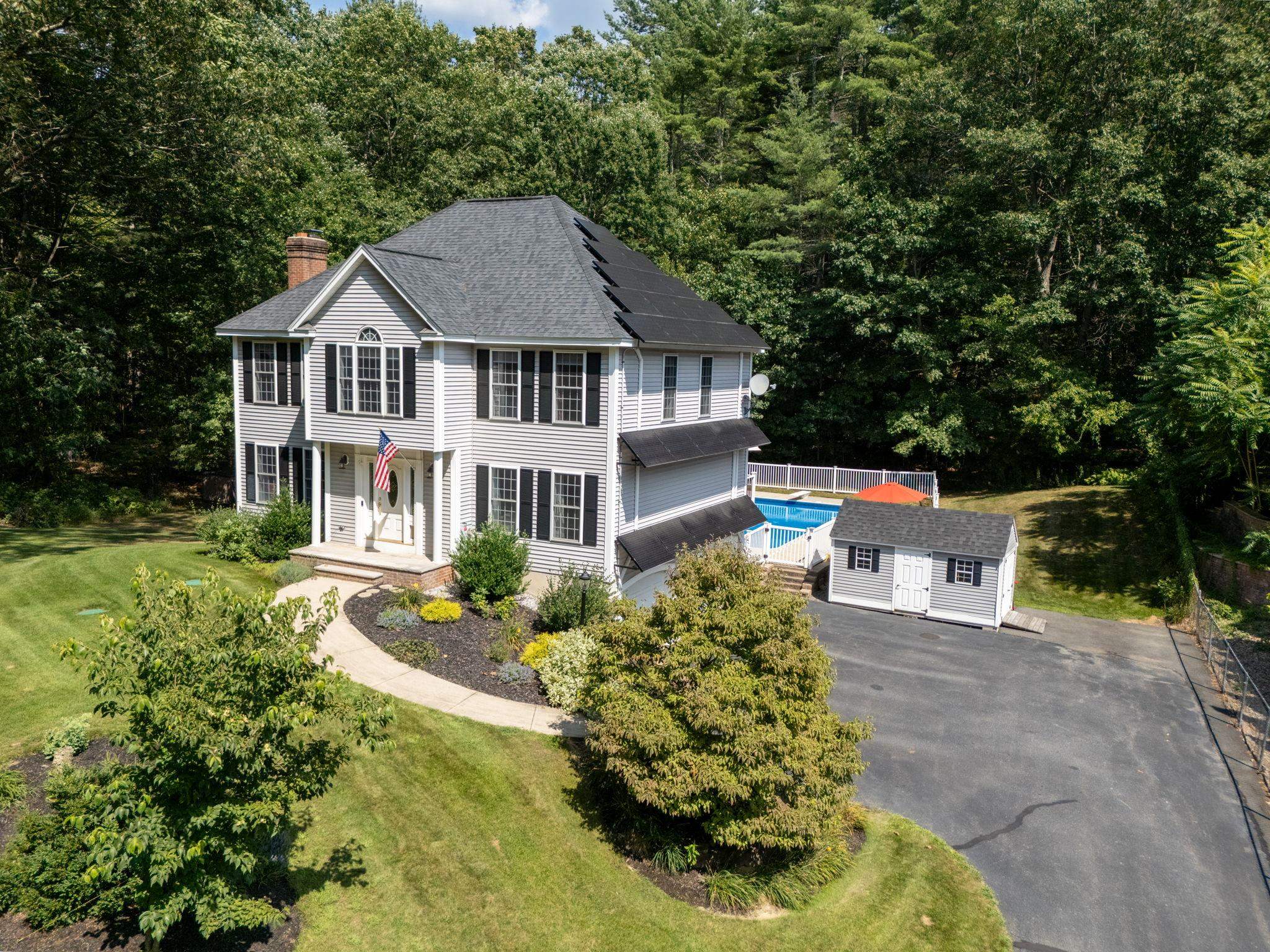 Welcome to 150 Kendall Pond Road in Windham, NH! Tucked away and surrounded by peaceful conservation land, this four-bedroom home offers a wonderful mix of privacy and convenience. You’ll be just minutes from shopping, dining, and major commuting routes, yet it feels like your own private getaway. Spend summers splashing in the in-ground pool and making memories in the spacious backyard. Inside, find an open concept kitchen with granite countertops and stainless steel appliances to make entertaining easy. The bathrooms have been updated with spa finishes and have the Wow! factor. The home is generator ready and comes with paid-off solar panels, helping you save on energy costs. Need more space? The unfinished walk-up attic offers endless possibilities, such as a playroom, home office, or extra bedroom down the road. All of this is located in a town known for its highly desired schools. This is a home where you can settle in, spread out, and enjoy the best of what Windham has to offer. Schedule your private showing today.