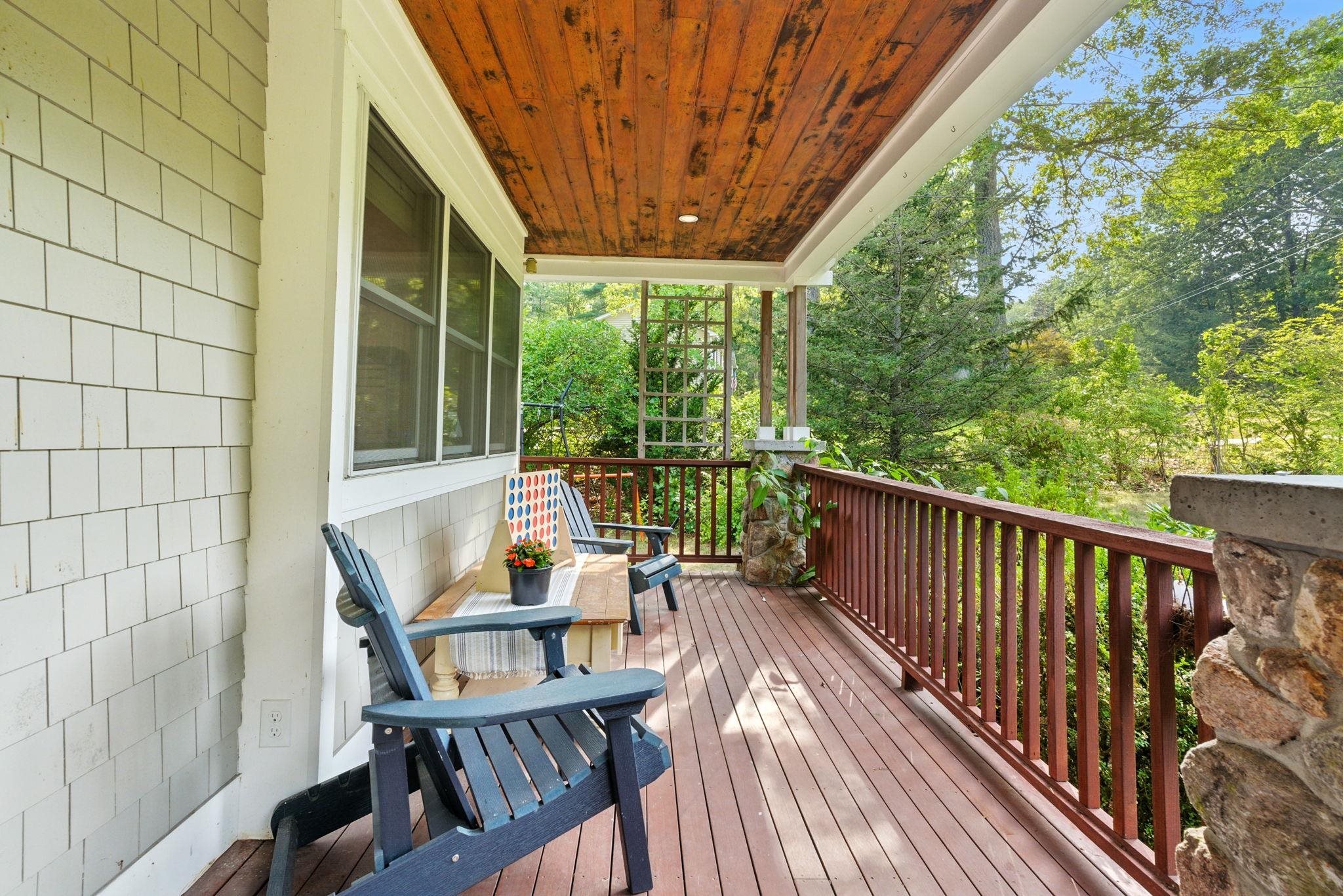 PRICE REDUCED>>OPEN HOUSE SAT 12-2PM & SUN 1-3PM! Tranquil cul-de-sac location & bordering Rainbow Lake, this refined Derry residence blends elegance with serene waterfront living. The foyer, accented with ambient lighting, welcomes you into light-filled spaces adorned with recessed lighting & brand new oak floors. The home offers 4 bedrooms, 2 1/2 baths, 2 inviting living rooms, one with a wood burning fireplace, dining room & well-lit office featuring pocket doors for privacy. A four-season sunroom & a three-season screened porch capture lake views! The completely renovated kitchen is a chef’s delight, featuring a F.lli Bertazzoni Induction Range & Blomberg Refrigerator, while taking in views of the lake. The 1st floor bathroom shares space with the laundry area where the LG ThinQ washer/dryer add modern convenience. Comfort is ensured with geothermal heating & cooling, oil backup, 2 zones for efficiency & synthetic slate roof with decades of longevity & owned solar panels. All the bedrooms are on the 2nd floor. The primary suite boasts a wood-burning fireplace, balcony with lake views, walk in closet & a luxurious en-suite with Wi-Fi speaker lighting. A whole-house generator offers peace of mind. Outdoors, a large deck, mature flowering bushes, apple & peach trees & a motorized awning create an idyllic retreat. A 2 stall garage with 3rd for equipment is useful! Close to shopping, dining & schools, this home offers a rare combination of high-end finishes & lakefront vistas.