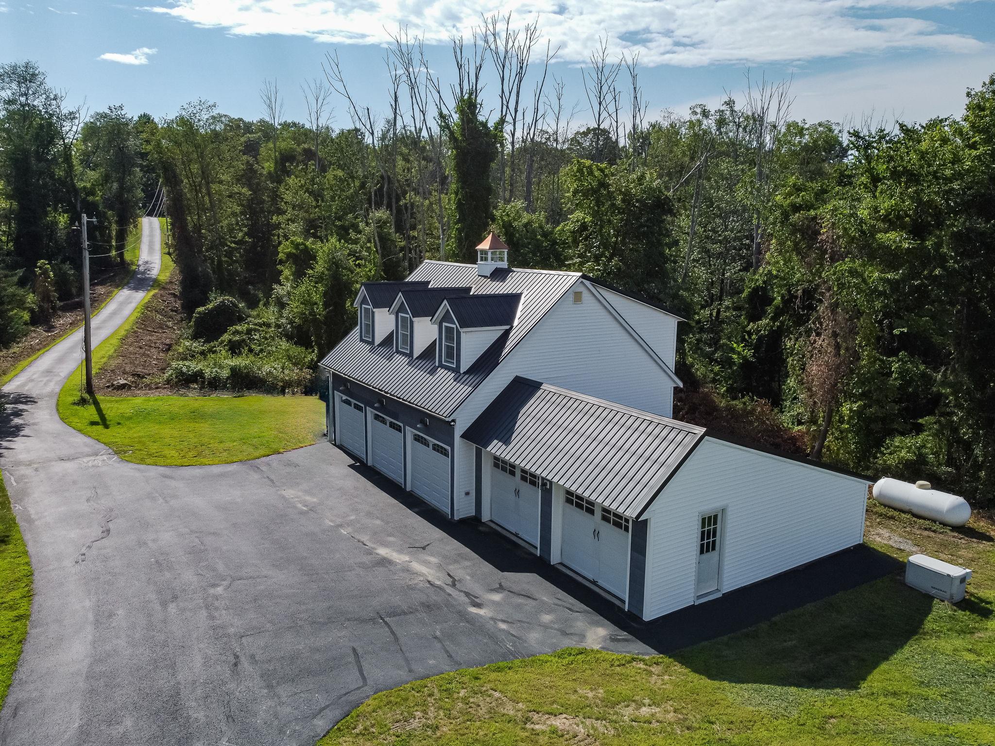 Paved driveway, set back from road