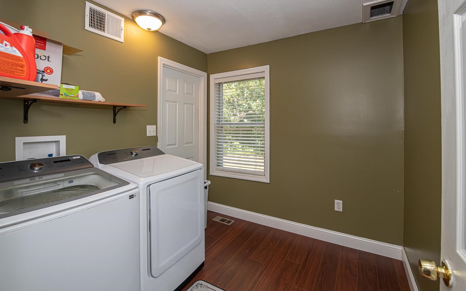 1st floor laundry room with door to basement