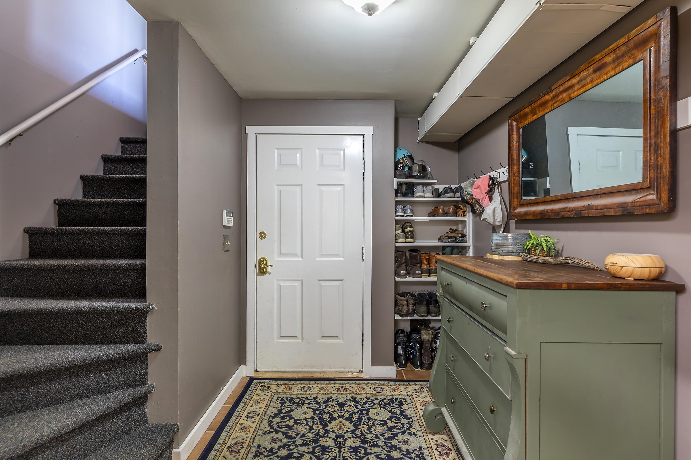 Stairs to mud room by garage