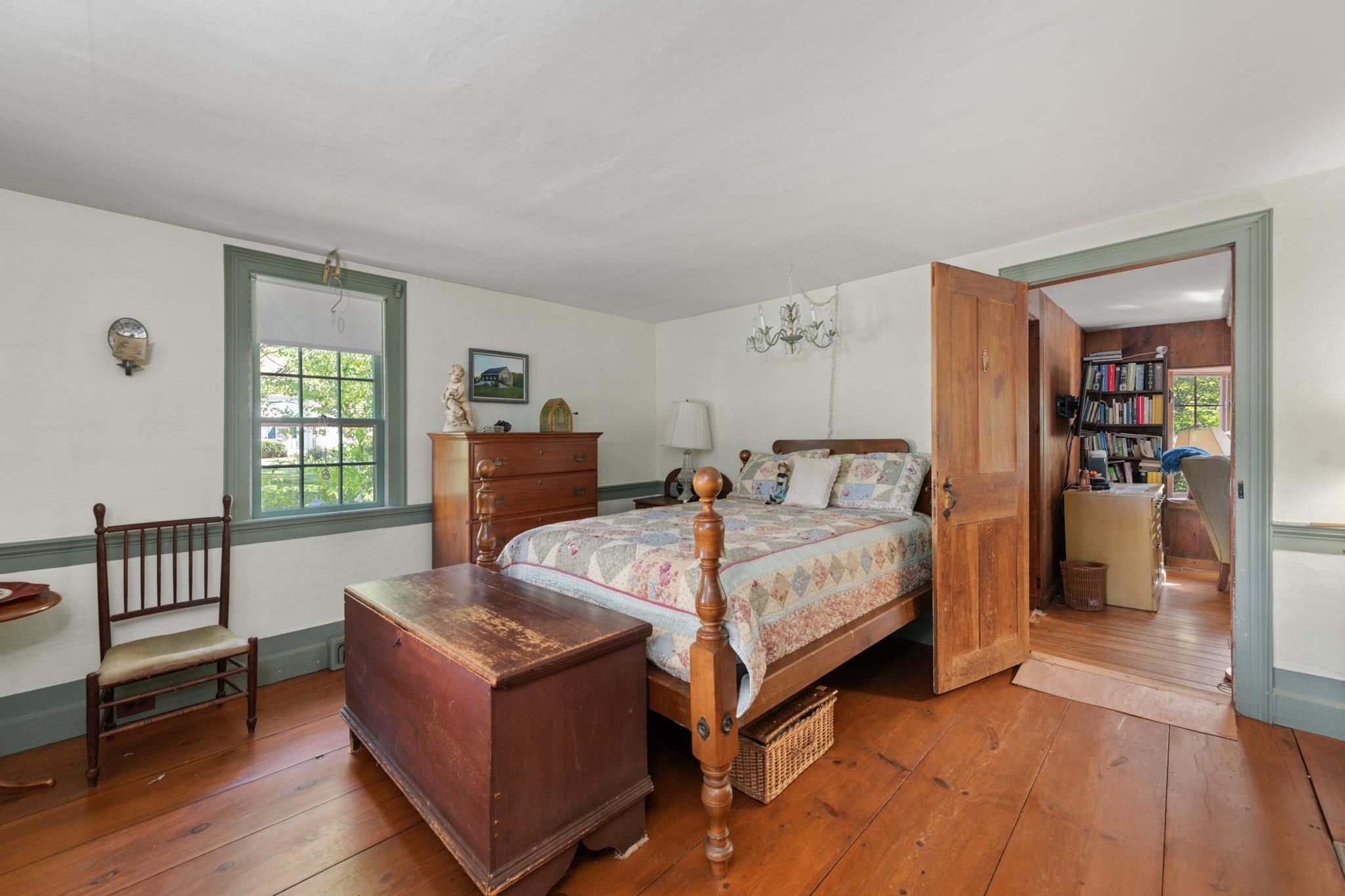 This rare first floor bedroom not only has a fireplace as well as built in cabinets