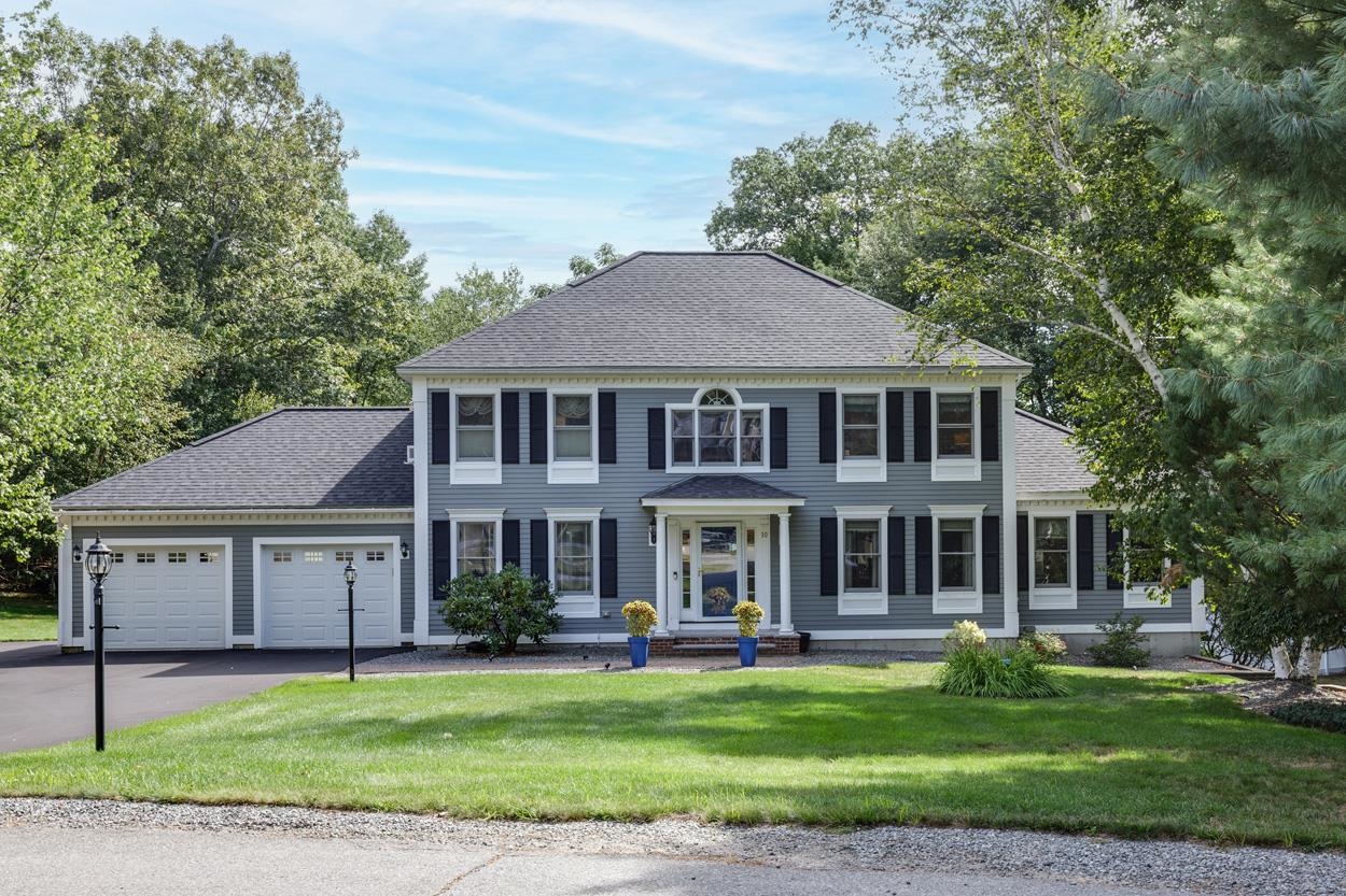 At the end of a quiet cul-de-sac in a sought-after Londonderry neighborhood, this hip roof Colonial combines classic style with an inviting layout designed for living well! Outside is your private resort: A gunite pool with built-in hot tub, an oversized fenced patio for lounging & two decks that provide the perfect spot for morning coffee or evening unwinding while overlooking the landscaped grounds. With mature plantings & irrigation in place, the setting stays lush & green with ease.  Inside, the home offers spaces that fit the rhythm of daily life as well as special occasions. The oversized kitchen is ready for holiday baking or hosting friends for casual meals. The Great Room with its wood-burning fireplace is equally suited for cozy winter nights or lively weekend get-togethers, while the heated sunroom brings the outdoors in all year long. Working from home? The true office, with a door for privacy, makes productivity easy. A formal dining room and first-floor laundry room add to the thoughtful flow.  Upstairs, the spacious primary bedroom with its own ¾ bath is a retreat of its own. Three additional bedrooms and an updated full bath provide comfort for family or guests. The lower level has a large finished space for movie nights, a second office or exercise plus a walk-out area with a second fridge & stove, perfect for poolside refreshments without ever heading upstairs. A new roof, siding & driveway = the big updates are already taken care of. Move right in & enjoy!