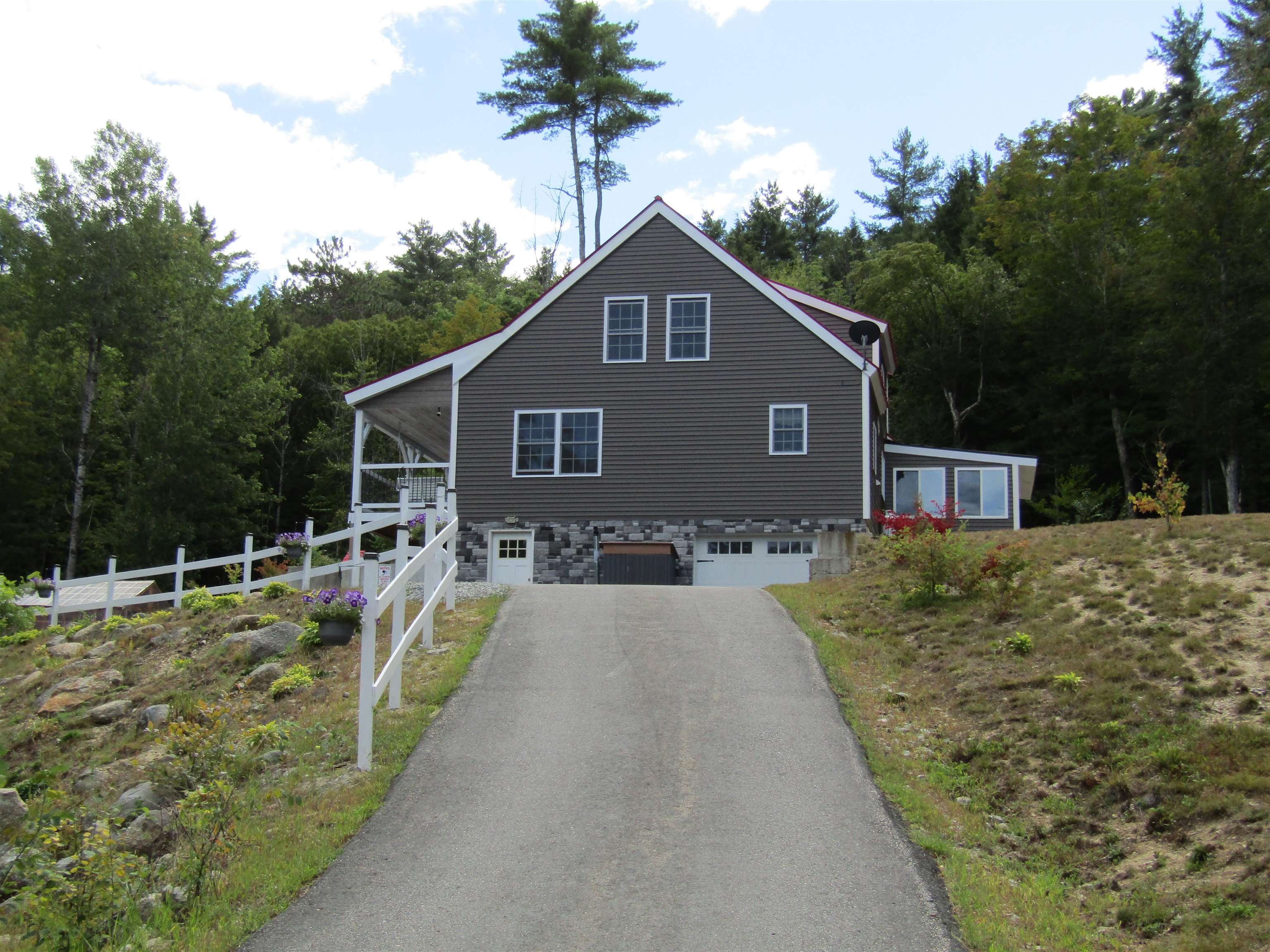 Side of Home and Driveway to Garage