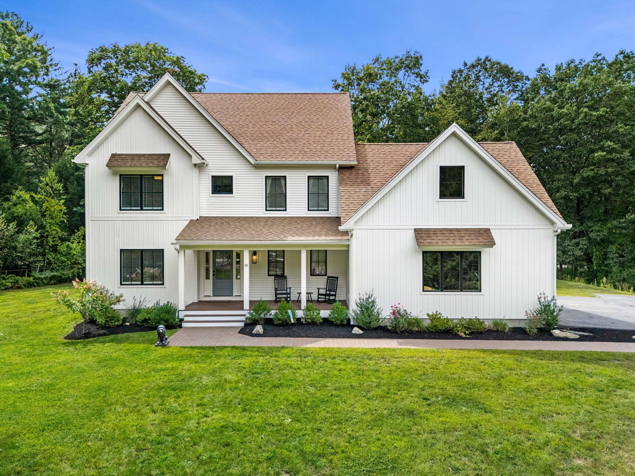 Welcome to 38 Kendall Pond Rd, a stunning 2-year-young Colonial in the highly sought-after town of Windham, NH. Designed with elegance and comfort in mind, this 4-bedroom, 2.5-bath residence showcases an open-concept floor plan with high-end finishes. The first floor welcomes you with sun-drenched living spaces, where the hardwood floors and oversized windows create a warm and inviting atmosphere. The kitchen is a true showpiece, featuring a large center island while flowing effortlessly into the dining and living areas—perfect for both intimate dinners and grand entertaining. A dedicated first-floor office provides the ideal setting for working from home in comfort and style. Upstairs, the primary suite offers a private retreat with a spa-like bathroom, complete with a tiled shower and double vanities. Three additional bedrooms provide ample space for family or guests. The unfinished walk-up attic presents endless possibilities for expansion, whether you envision a media room or luxurious guest suite. Outdoors, the large 2.13-acre lot offers privacy and tranquility, with plenty of space to design your dream outdoor oasis. Ideally located with easy access to Route 111 and just minutes from the highway, shopping, and dining. This exceptional home captures the very best of modern luxury living and is truly a rare offering in Windham. Showings begin at the open house Friday 9/5 5:00PM to 6:30PM. Open houses also Saturday 9/6 11:00AM to 1:00PM and Sunday 9/7 10:30AM to 12:00PM