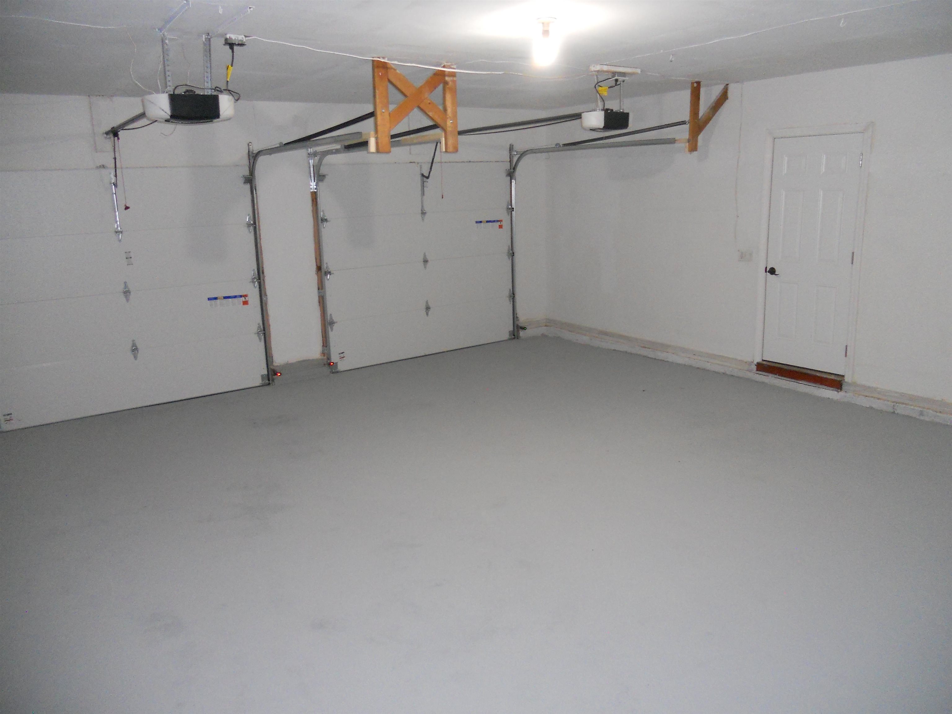 Heated Attached Garage with New Insulated Overhead Doors