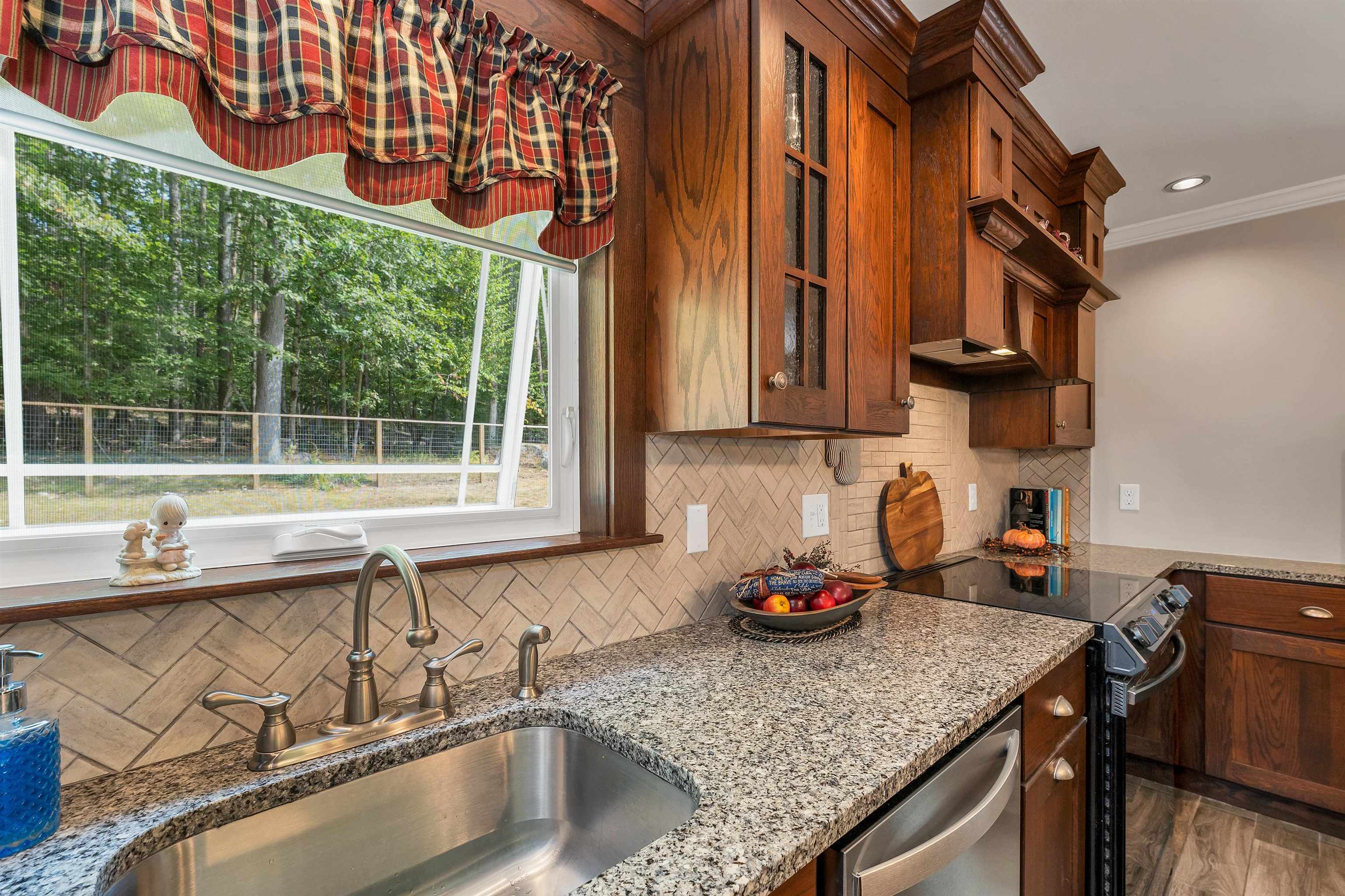 Granite counters and tiled backsplash