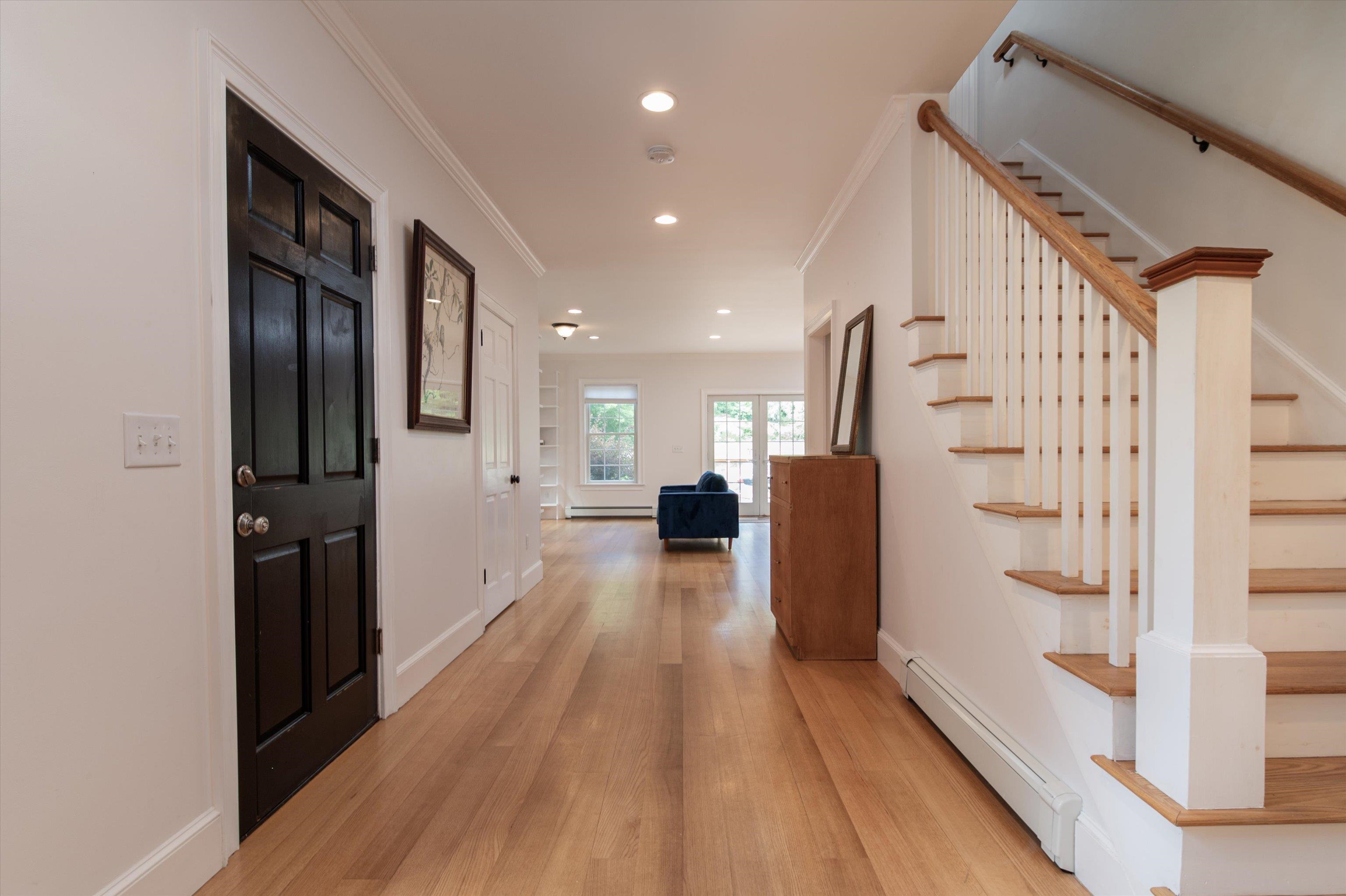 Stairs leading to west wing, 2 bedrm and full bath