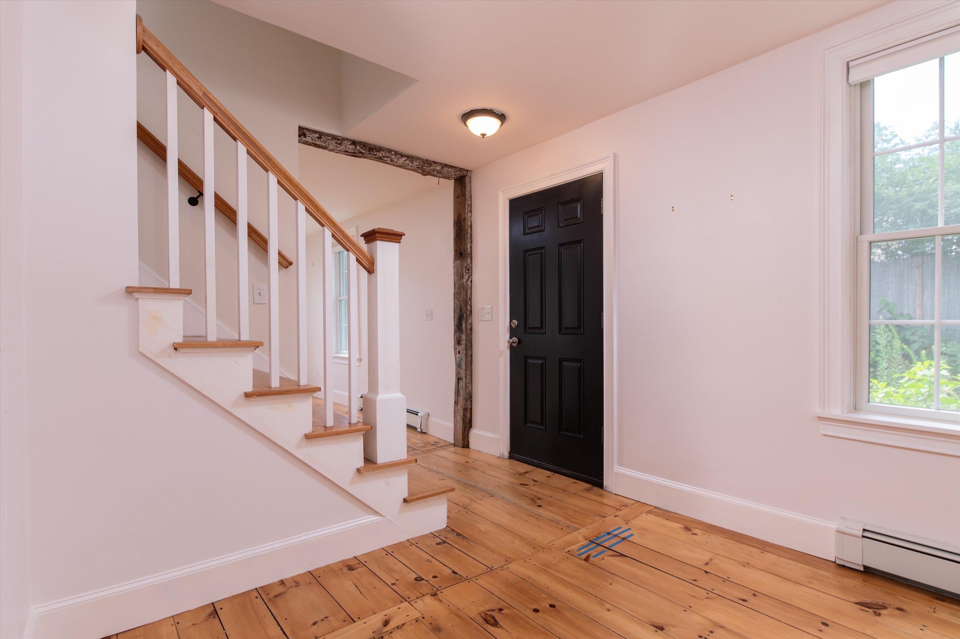 Stairs leading to primary bedroom, office and full bath