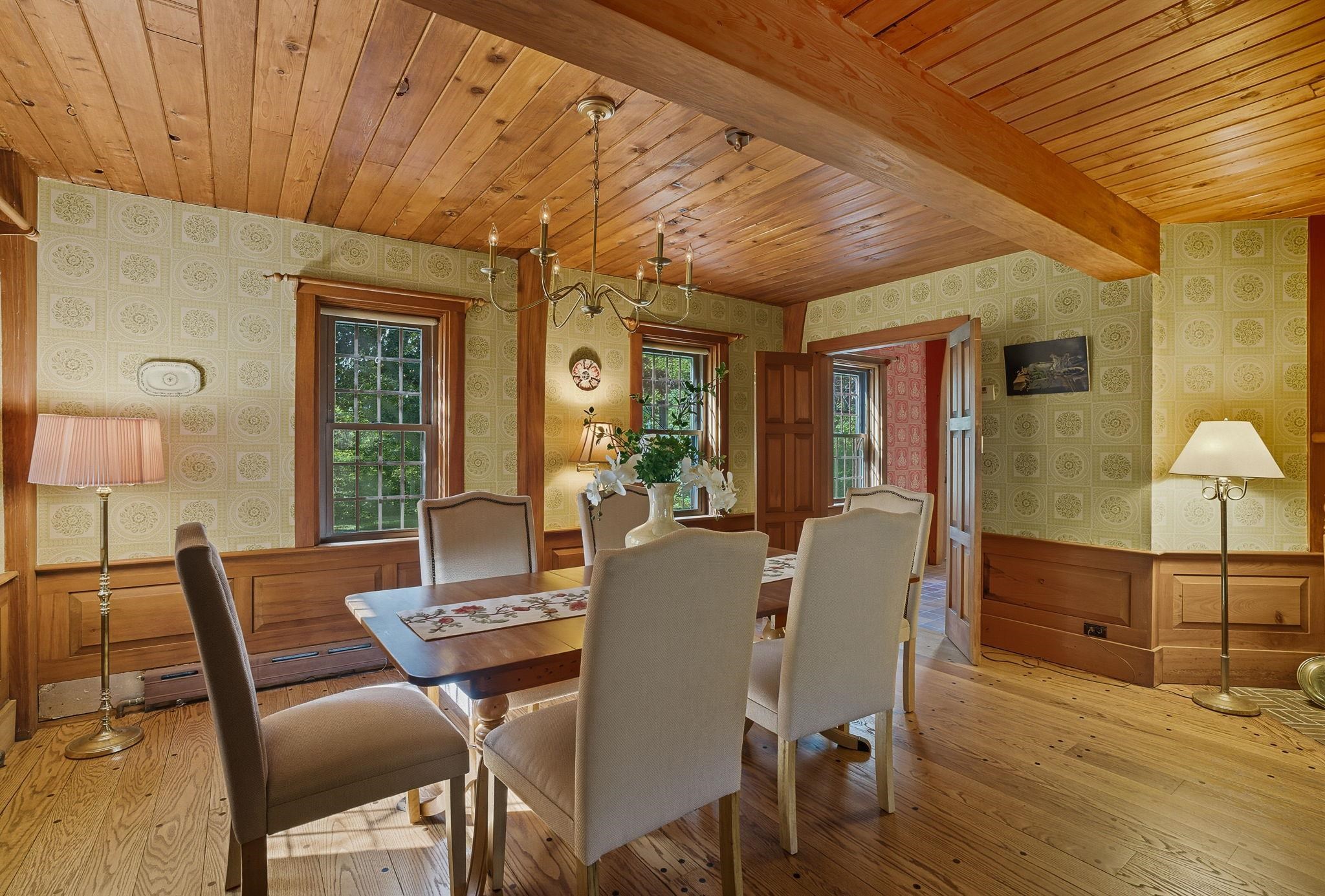 Dining Room w/ Raised Panel Wainscoting & Beamed Ceiling