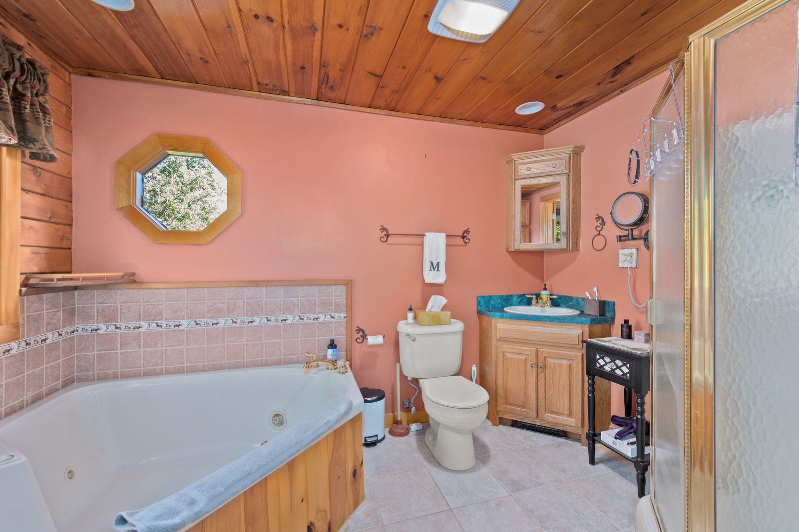 PRIMARY BEDROOM WITH TUB & SHOWER